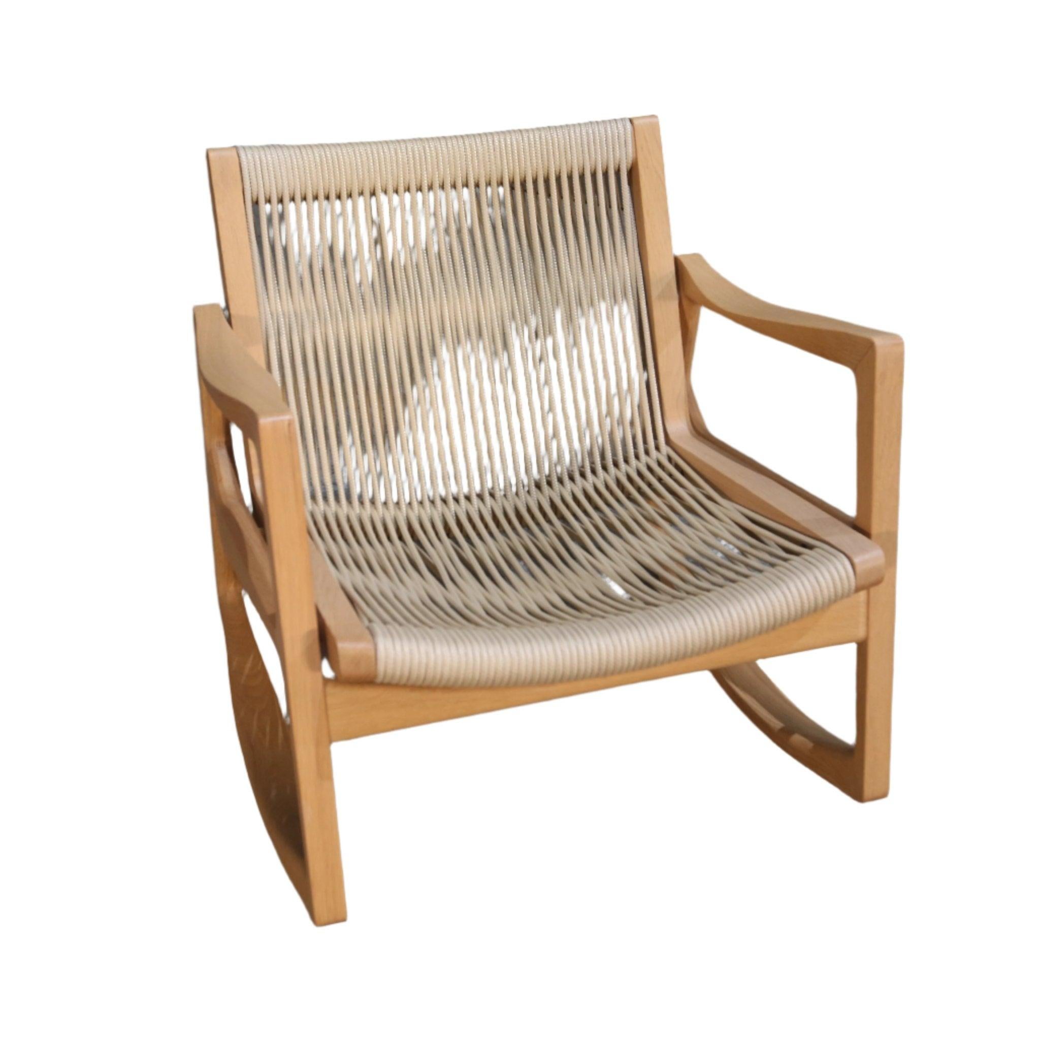 Introducing the Euvira Rocking Chair, a stunning piece designed by Jader Almeida. Crafted with the finest materials, this chair exudes luxury and sophistication. The sleek and modern design is complemented by the smooth curves and impeccable