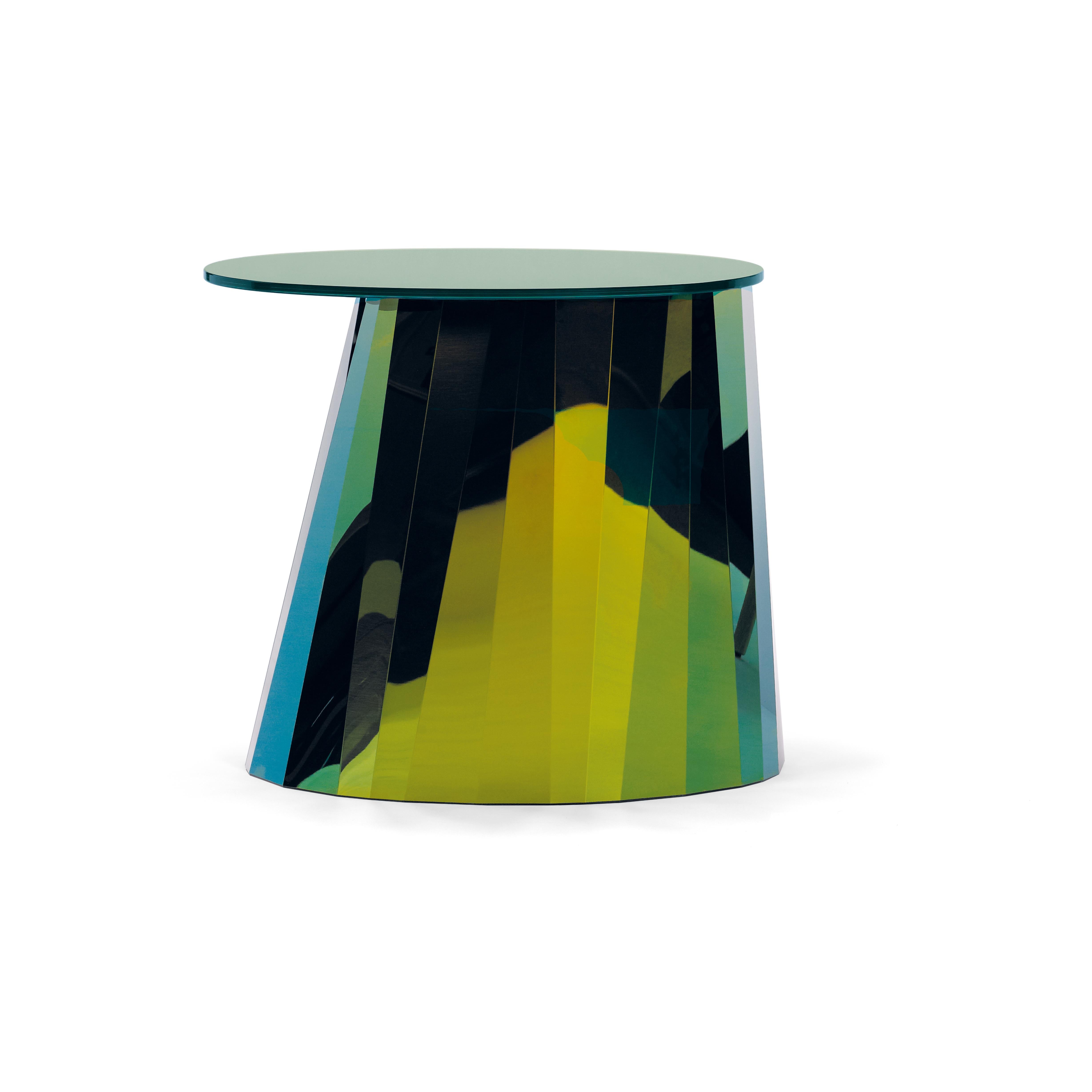 With the Pli side table series French designer Victoria Wilmotte brings objects of unusual crystalline elegance and astonishing geometry to living environments. The bends and folds that gave Pli its name almost make the stainless steel base look