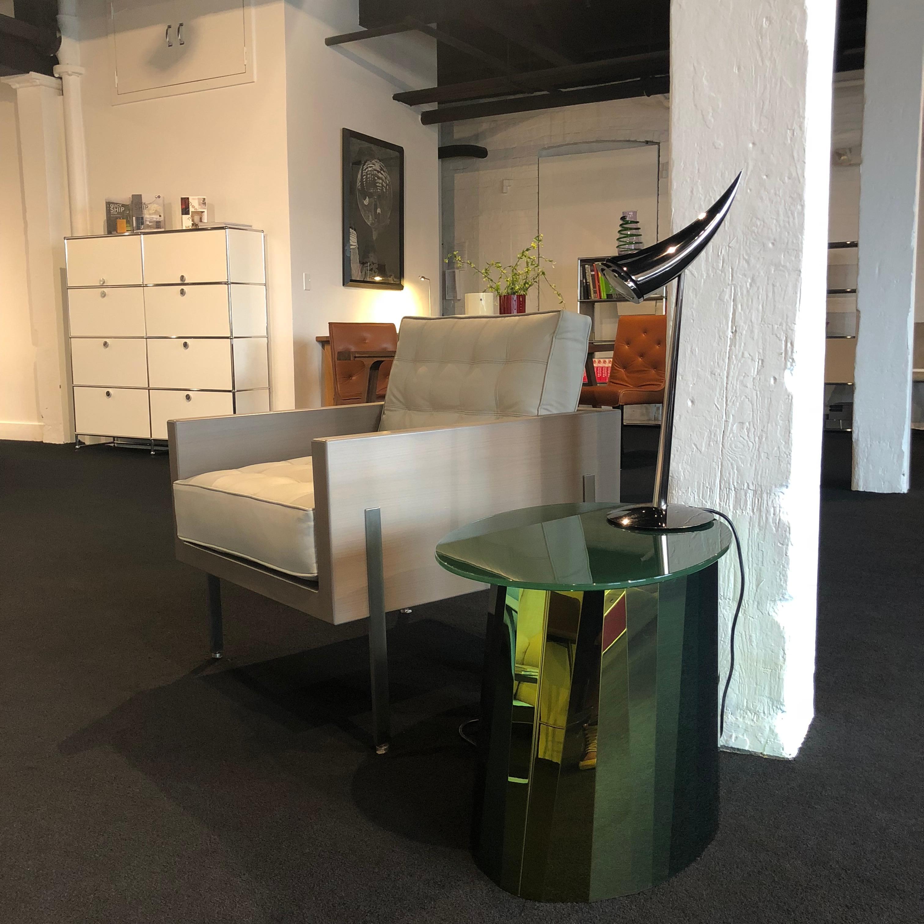 With the Pli side table French designer Victoria Wilmotte brings objects of unusual crystalline elegance and astonishing geometry to living environments. The bends and folds that gave Pli its name almost make the stainless steel base look like an