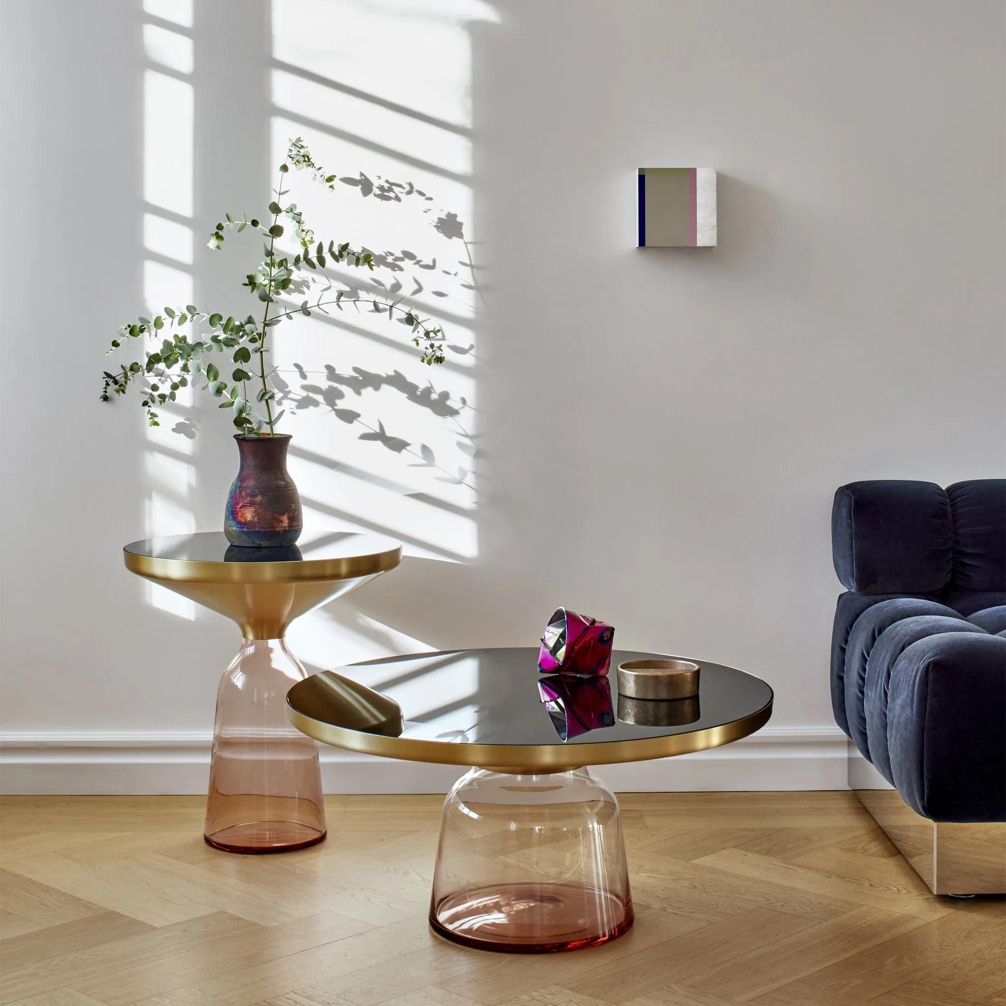 
The bell table by Sebastian Herkner turns our perceptual habits on their head, using the lightweight, fragile material of glass as base for a metal top that seems to float above it. Hand blown in the traditional manner using a wooden mold, the