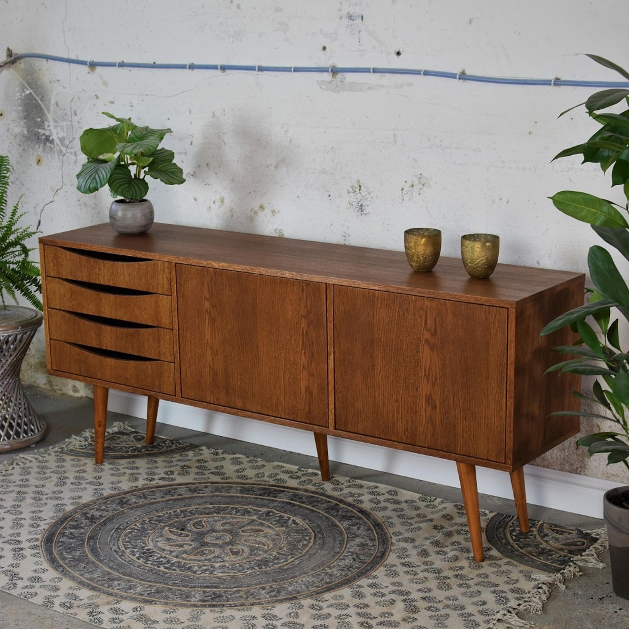 Classy Brown Extra Large Sideboard by Pastform
Dimensions: D 40 x W 190 x H 75 cm.
Materials: Stained and varnished wood.

Available in different wood color finishes: Whiskey, Rum, BPA, Nobel, Brandy, Schwarz, and Natura. Available in four different