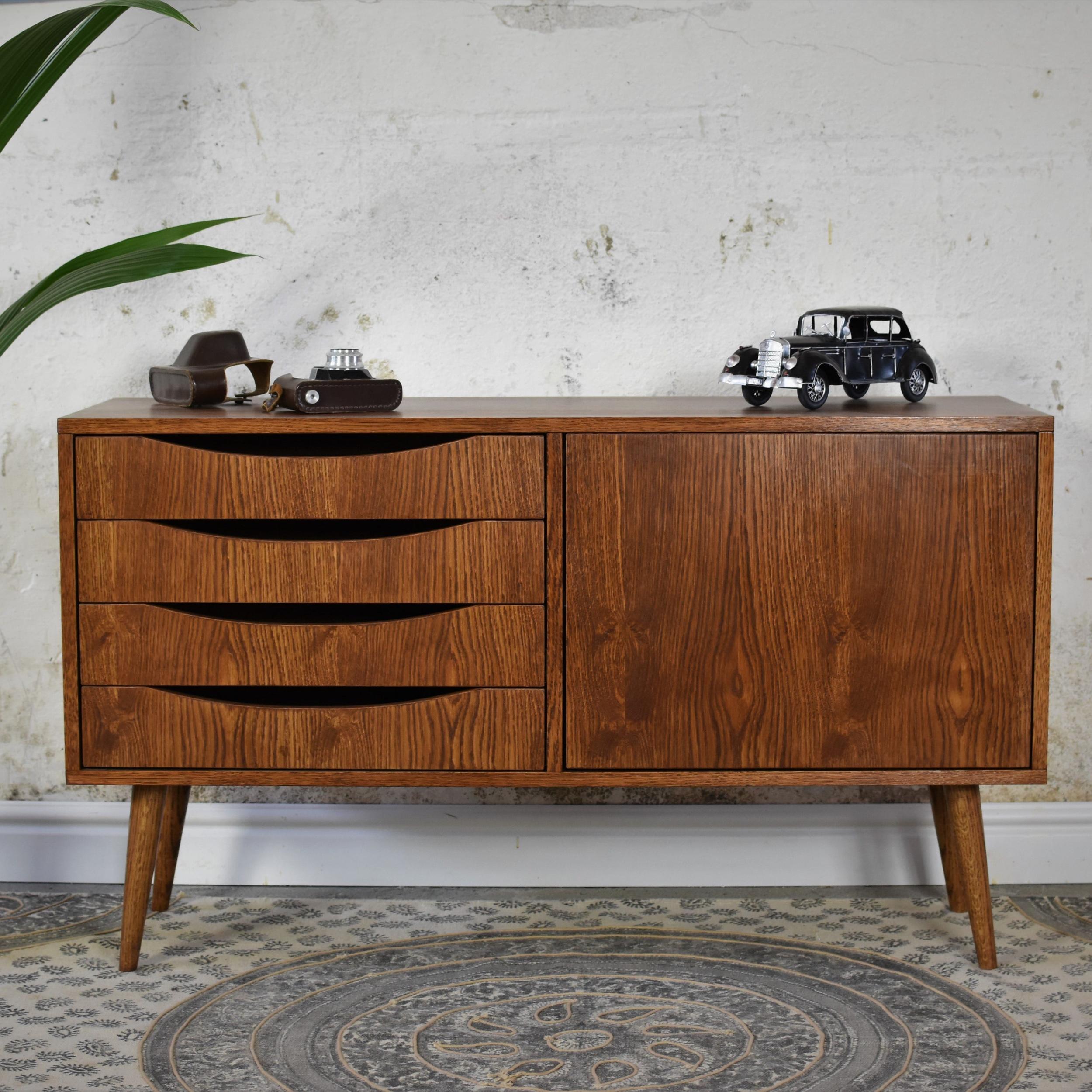 Classy Brown Mini Medium Sideboard by Pastform
Dimensions: D 40 x W 100 x H 75 cm.
Materials: Stained and varnished wood.

Available in different wood color finishes: Whiskey, Rum, BPA, Nobel, Brandy, Schwarz, and Natura. Please contact us.

The