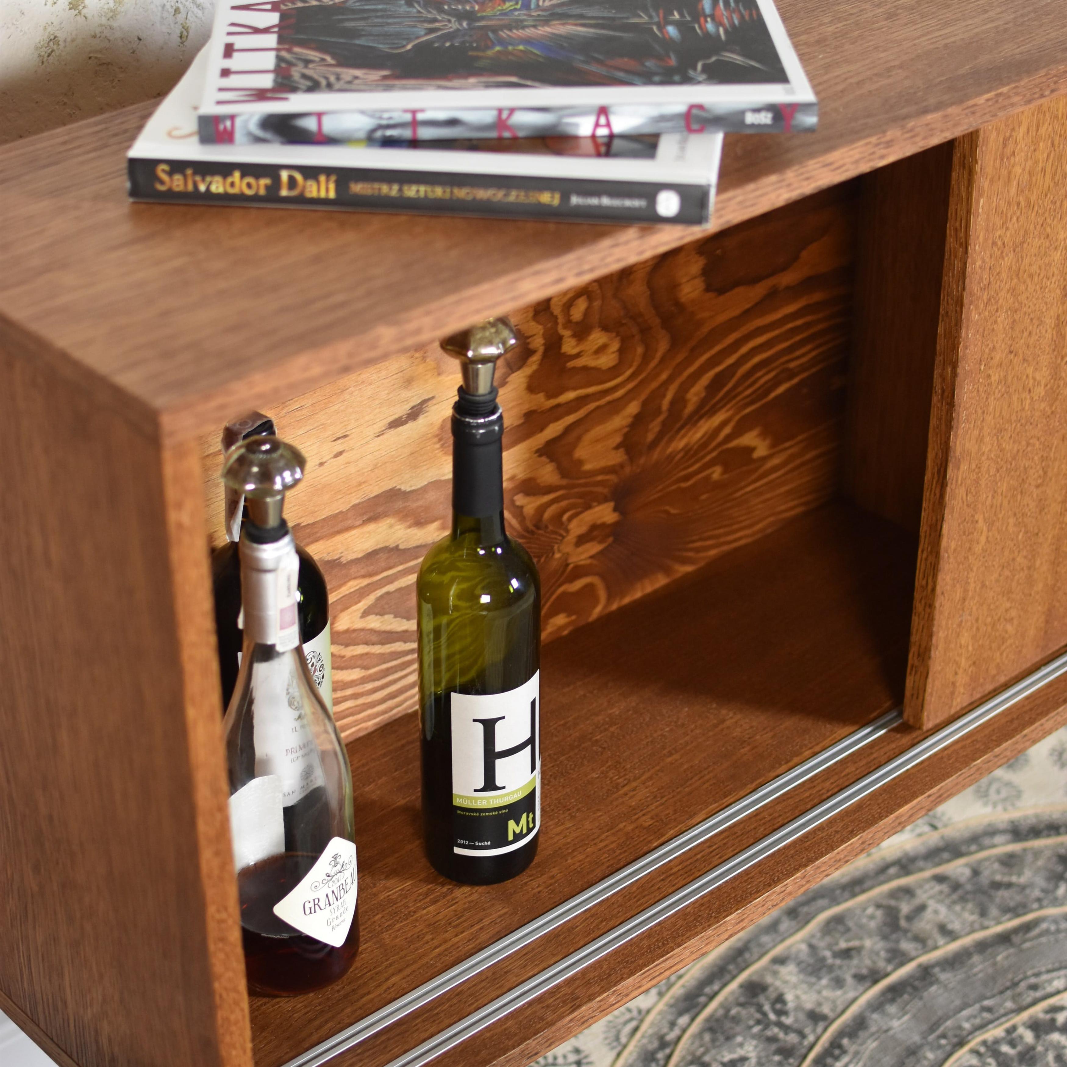 Classy Brown Slide Small Sideboard by Pastform
Dimensions: D 35 x W 140 x H 75 cm.
Materials: Stained and varnished wood.

Available in different wood color finishes: Whiskey, Rum, BPA, Nobel, Brandy, Schwarz, and Natura. Available in five different