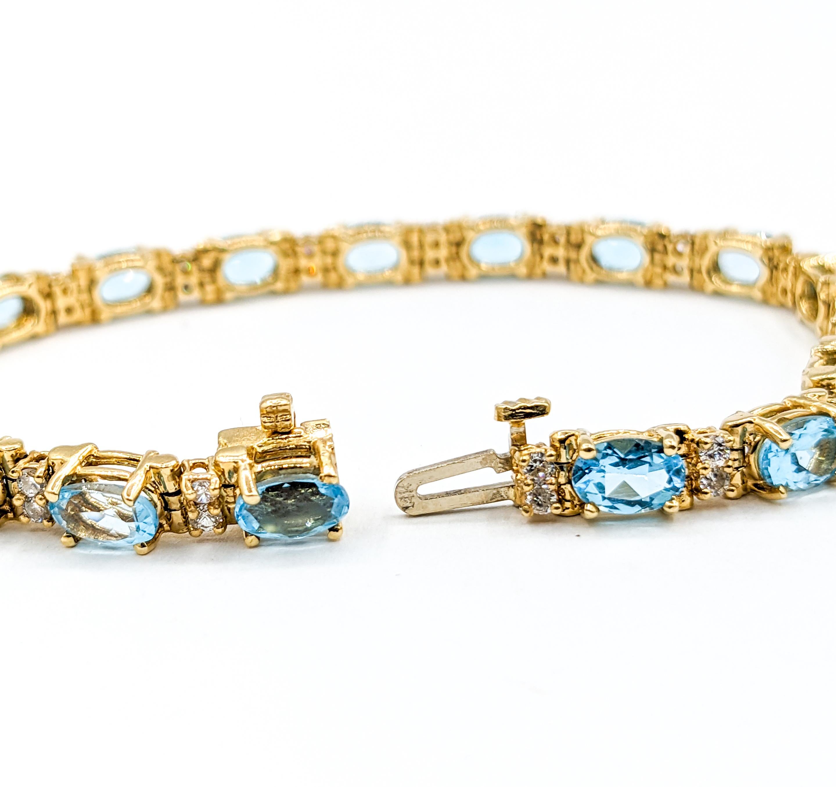 Women's Classy Diamond & Blue Topaz Tennis Bracelet in Gold For Sale