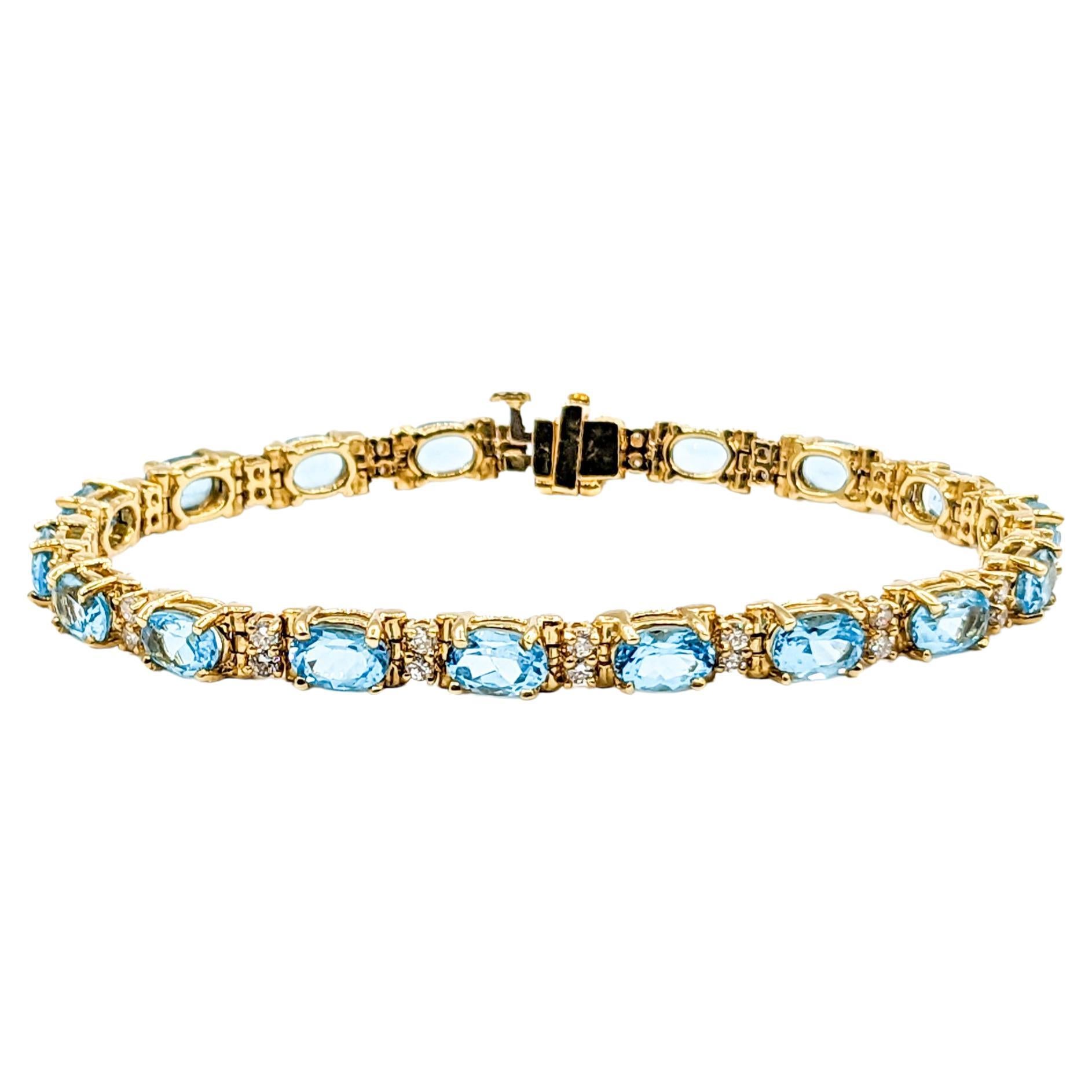 Classy Diamond & Blue Topaz Tennis Bracelet in Gold For Sale
