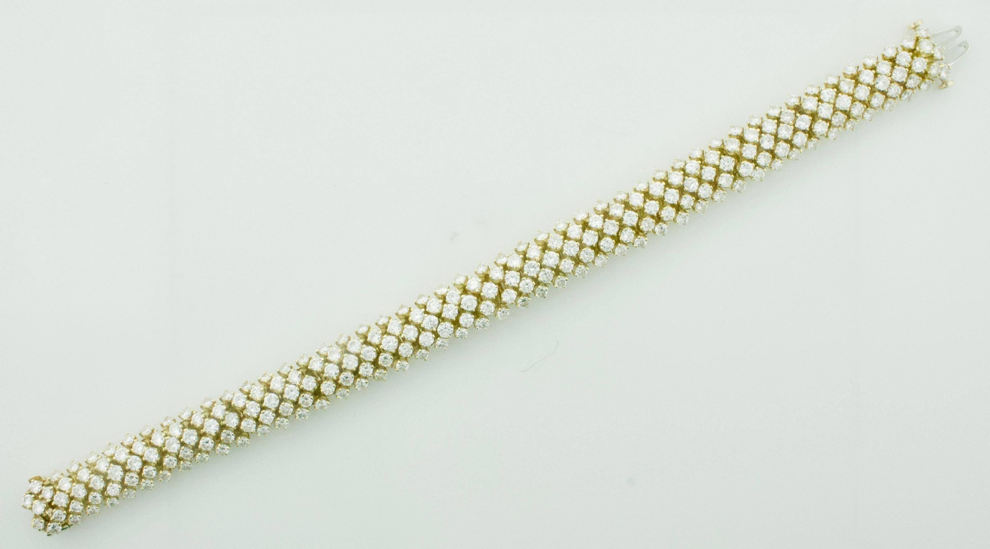 Classy Diamond Bracelet in 18k Yellow Gold
235 Round Brilliant Cut Diamonds Weighing 12.00 Carats Approximately [GHI - VVS1-VS1]
[bright with no imperfections visible to the naked eye]
Flexible as Can Be.  Extreamly Comfortable.  A Show Stopper For