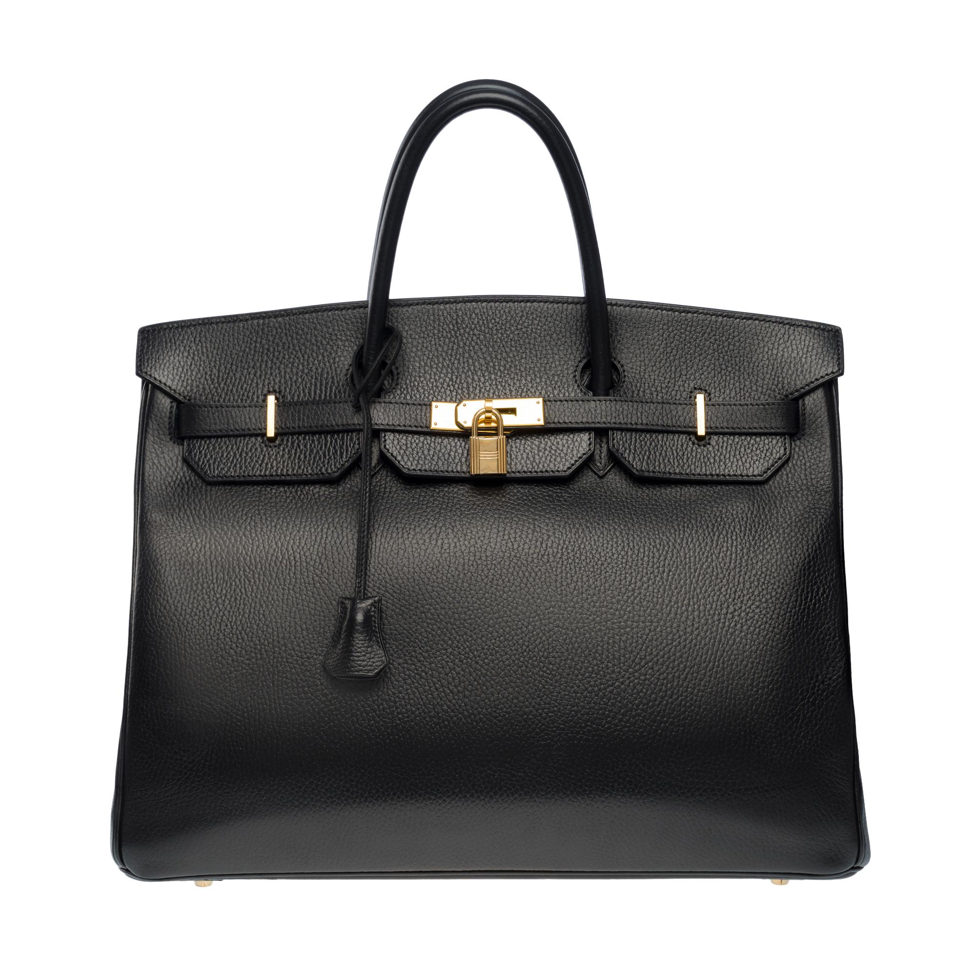 Beautiful​ ​Hermes​ ​Birkin​ ​40​ ​cm​ ​in​ ​black​ ​Vache​ ​Ardennes​ ​calf​ ​leather,​ ​gold​ ​plated​ ​metal​ ​hardware,​ ​double​ ​handle​ ​in​ ​black​ ​leather​ ​allowing​ ​a​ ​hand​ ​carry

Flap​ ​closure
Black​ ​leather​ ​inner​ ​lining,​ ​​