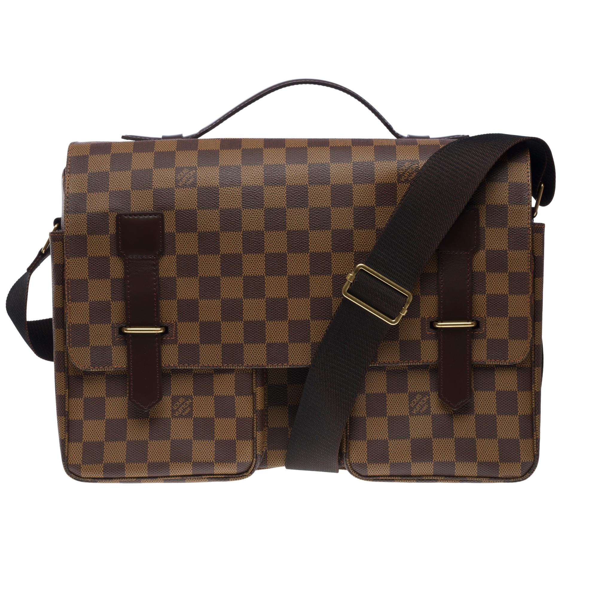 Elegant​ ​Louis​ ​Vuitton​ ​Broadway​ ​Messenger​ ​crossbody​ ​bag​ ​in​ ​brown​ ​coated​ ​checkered​ ​canvas​ ​and​ ​brown​ ​leather,​ ​golden​ ​metal​ ​trim,​ ​simple​ ​brown​ ​leather​ ​handle,​ ​an​ ​adjustable​ ​brown​ ​canvas​ ​handle​ ​for​