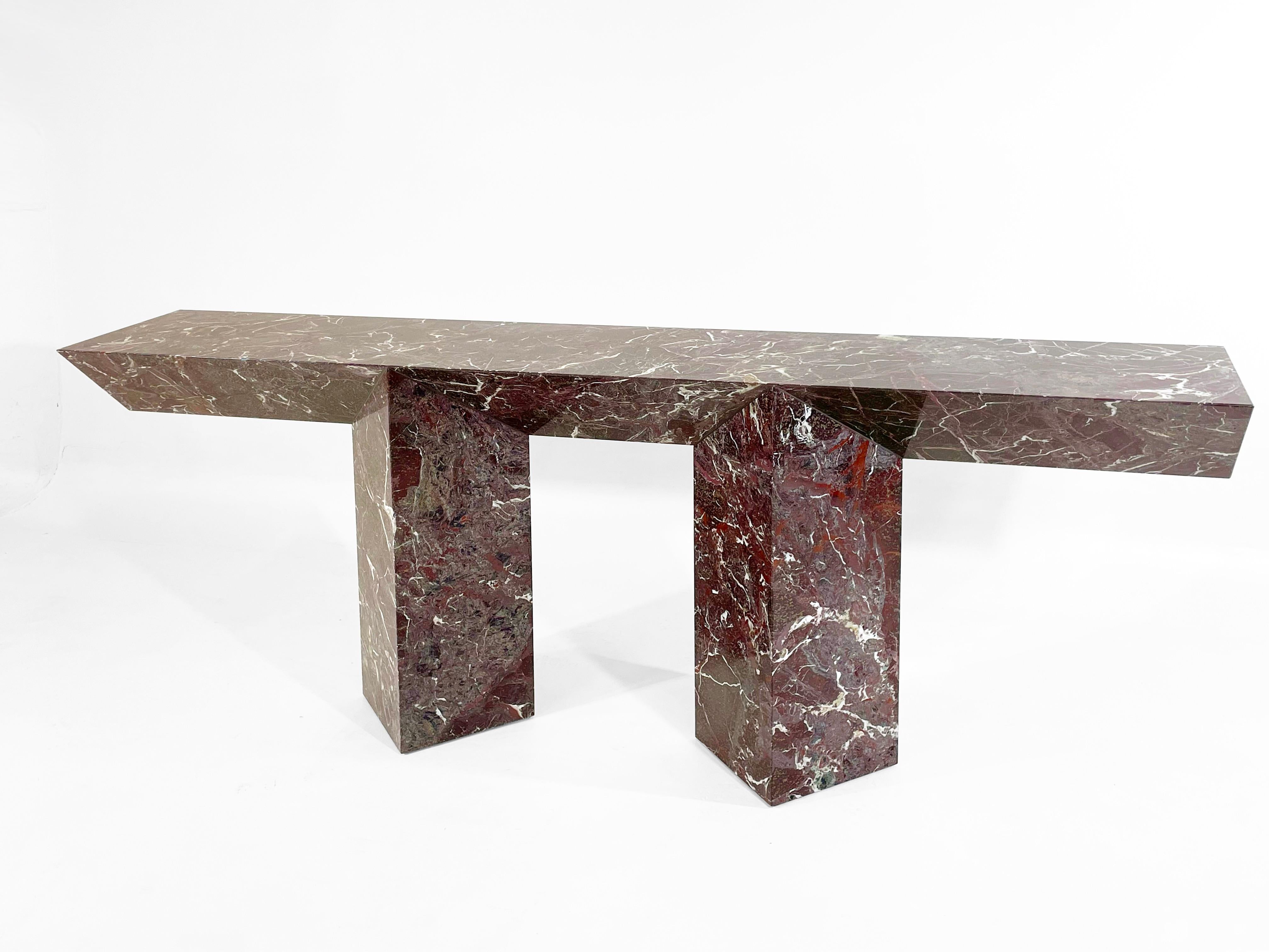 An all marble console that explores the sculptural possibilities of interconnecting triangles. Available in custom heights and lengths this console plays with symmetry and proportion to create a finished piece that feels balanced and grounded.