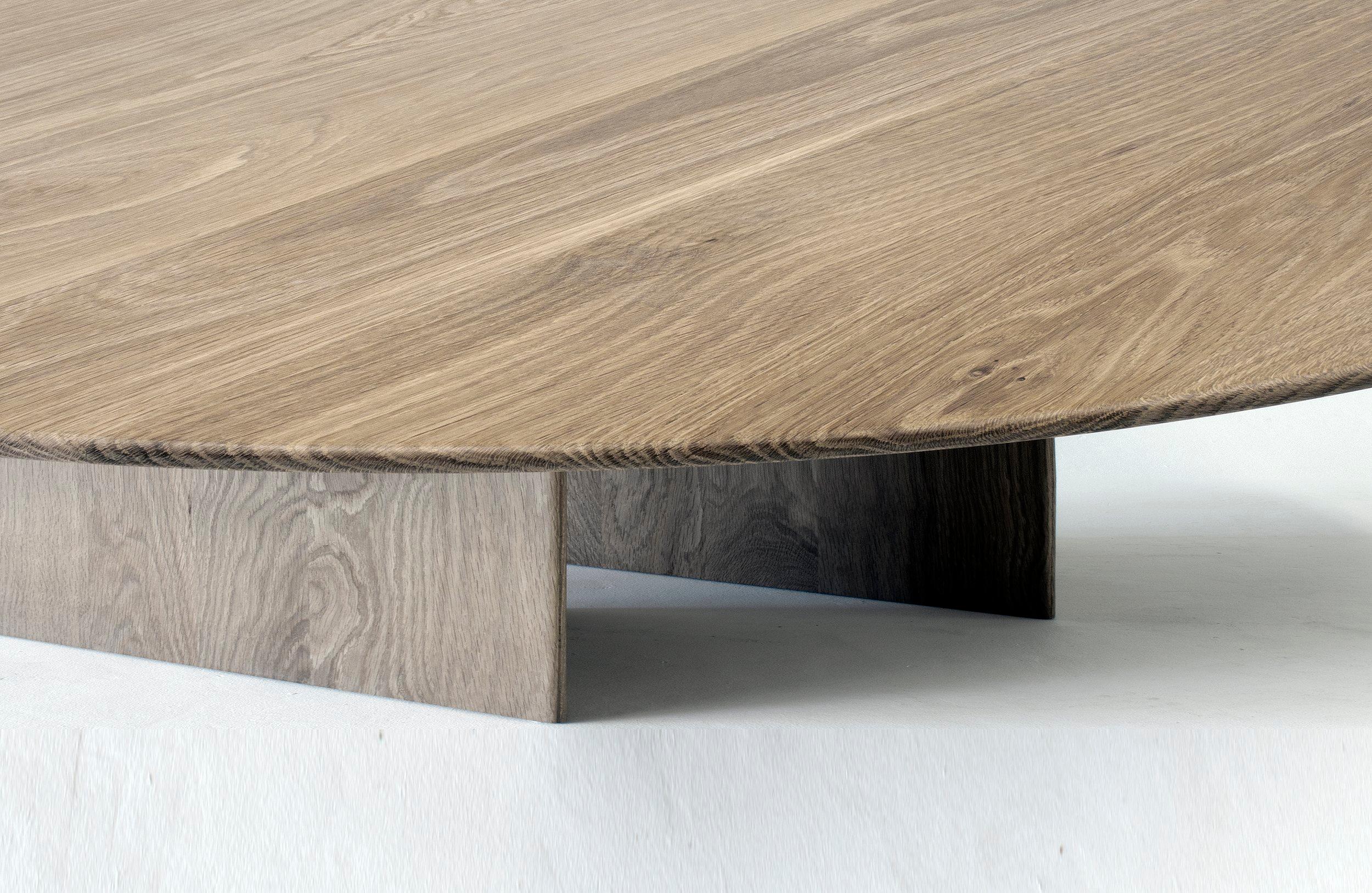The coffee table version of this table explores similar ideas to the dining table Great Expectations that inspired the design for this piece.  The offset base allows for a variety of differing visuals depending on the line of sight while the thin