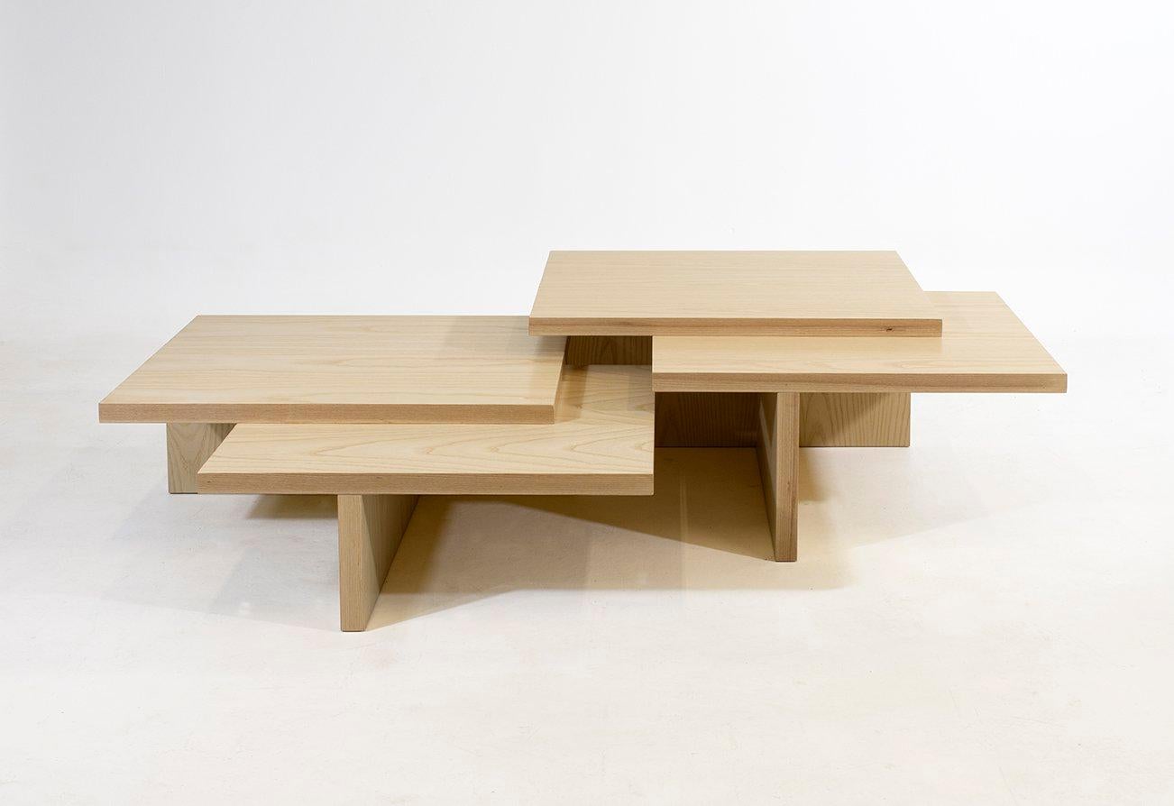 The driving idea behind the design of this piece was the desire to create a table that could be extended infinitely. The double layering of the top combined with differing heights of each table allows for a variety of nesting options that can expand