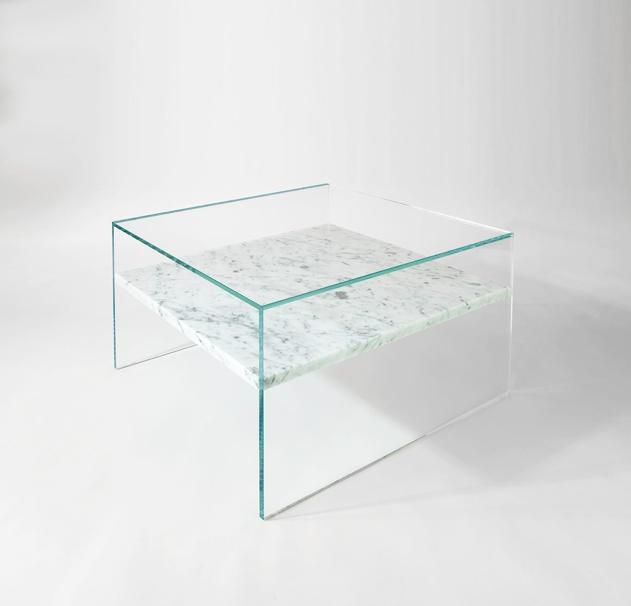 A side table with floating marble shelf that is as functional as it is beautiful. The glass enclosure allows for items to be displayed on both surfaces and is available in both ultra-clear and bronzed glass which allows for multiple combinations of