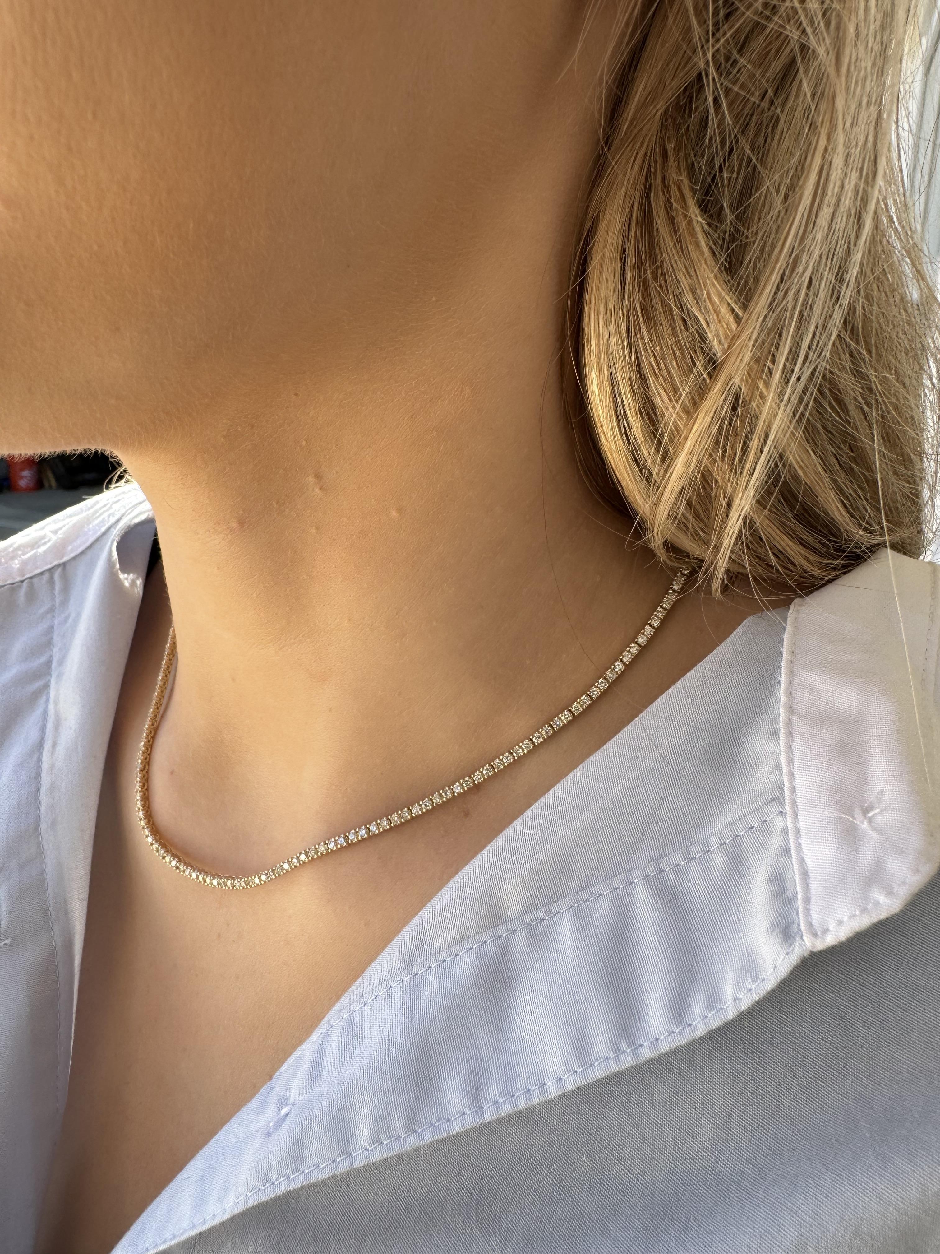 We love the classic look of these diamond tennis necklace!
Perfect for everyday love & wear.

Necklace Details
Material: 14K Yellow Gold
Length: 16 Inches

Accented by the following gemstones
216 - 1.8mm Round Brilliant Cut Diamonds; HI Color; SI