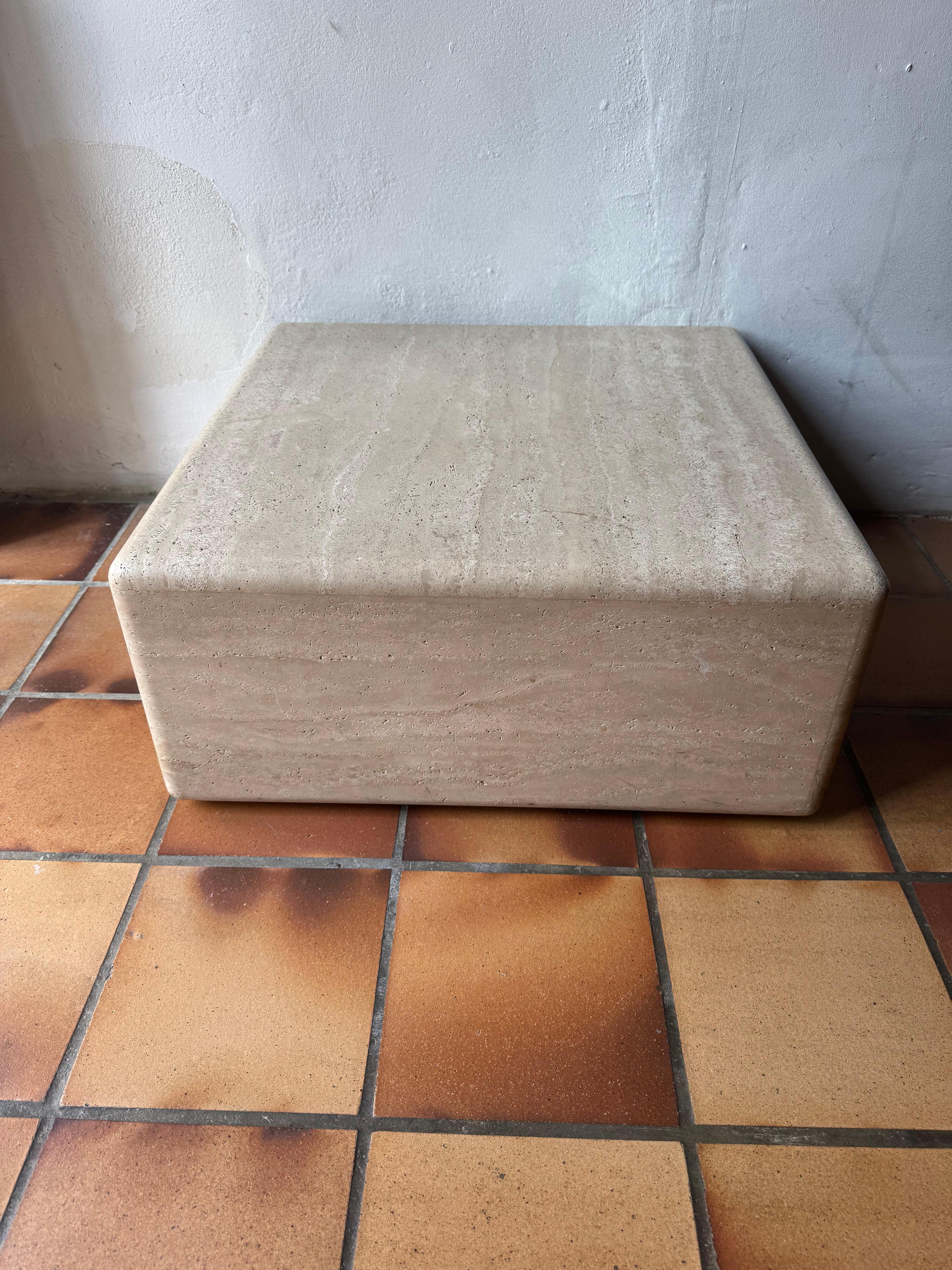 Beautiful rounded edge coffee table on wheels designed by Claude Berraldacci c.1990’s. Composed of travertine from Tivoli. Very well executed. 