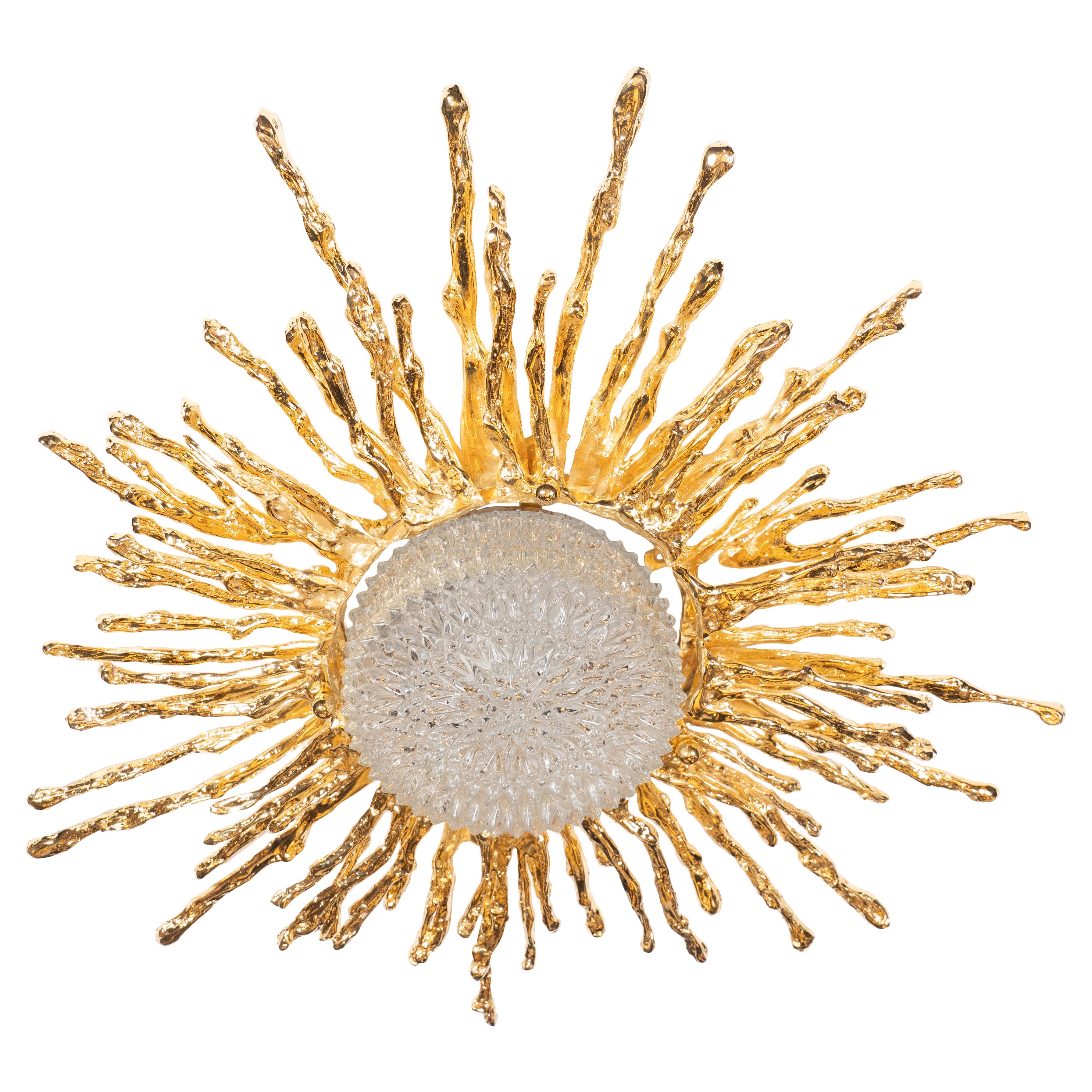 This stunning and dramatic flush mount chandelier was hand crafted by the esteemed artist Claude Boeltz in France. It features an expressionistic sunburst pattern realized in exploded bronze plated in pure 24-karat yellow gold, the tendrils