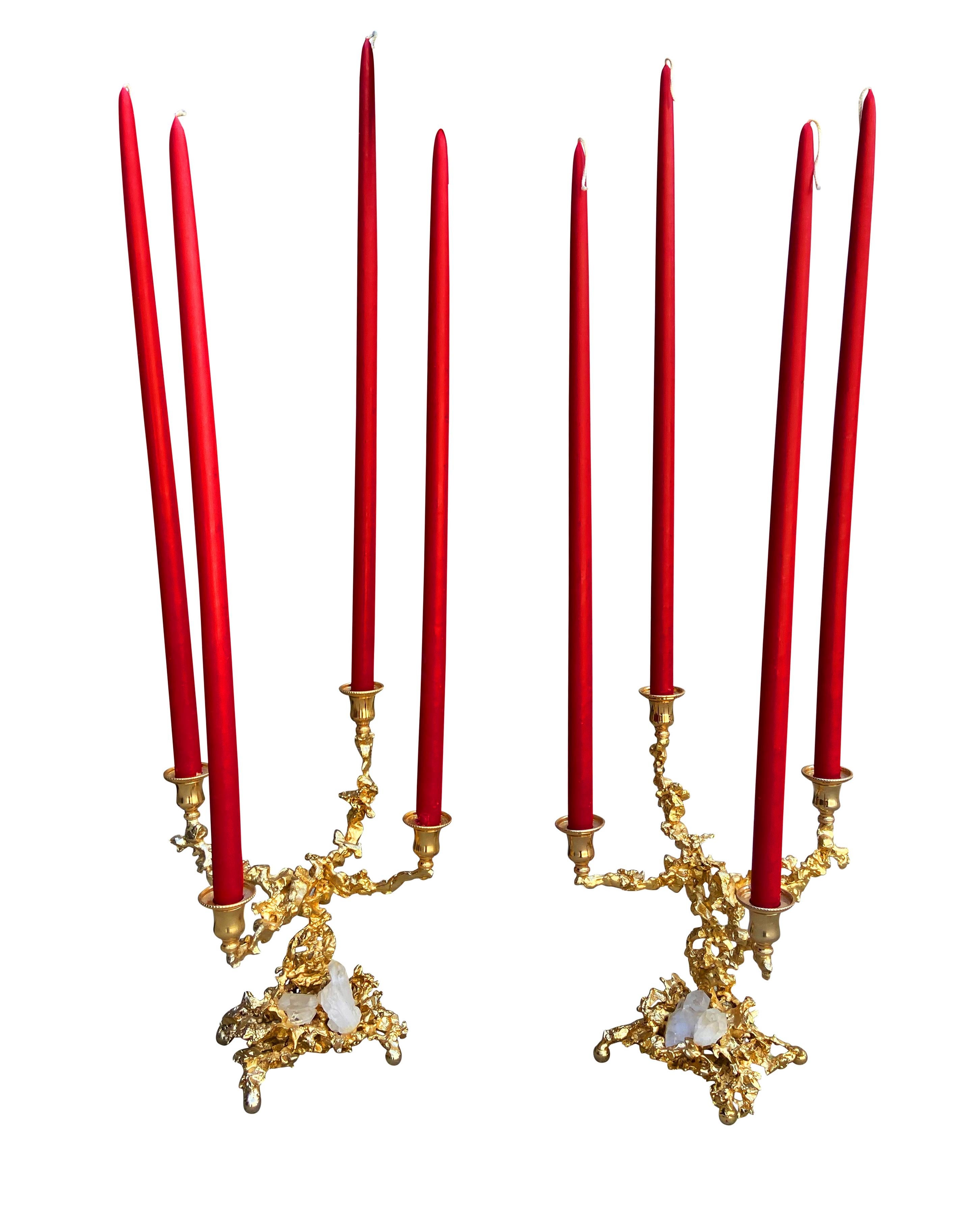 A stunning and classy pair of candlesticks handcrafted by Claude Boeltz in France, circa 1970s. These features hand-sculpted bronze structures, 24-karat gold-plated, and garnished with rock crystals. Artist marks to each. The price includes the pair