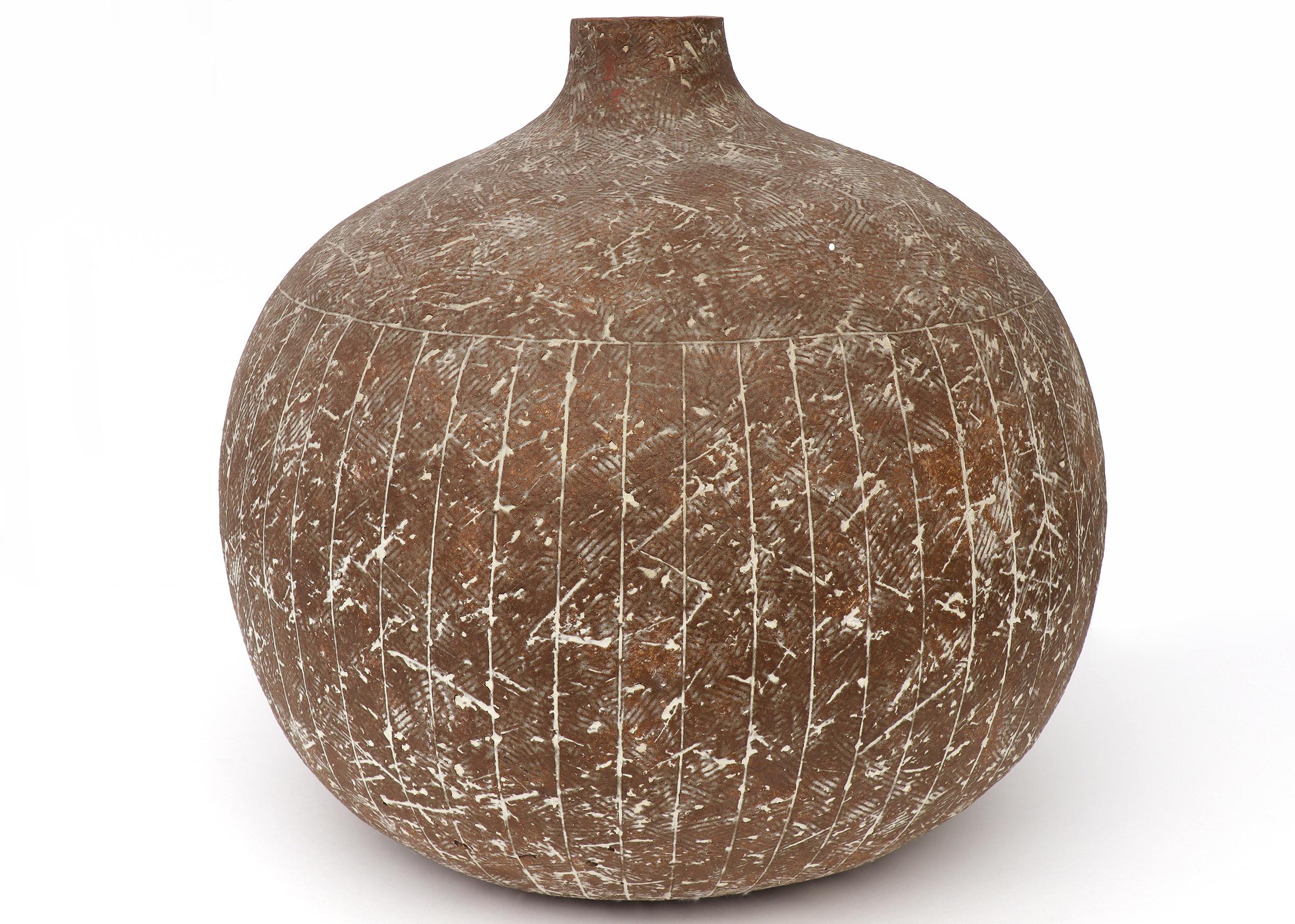 Brown ceramic pot with white parallel lines and etchings throughout by 20th Century artist Claude Conover. Narrow opening at the top, signed and titled on the base. Dimensions measure at 16 inches height and 16 inches in diameter.

Piece is clean