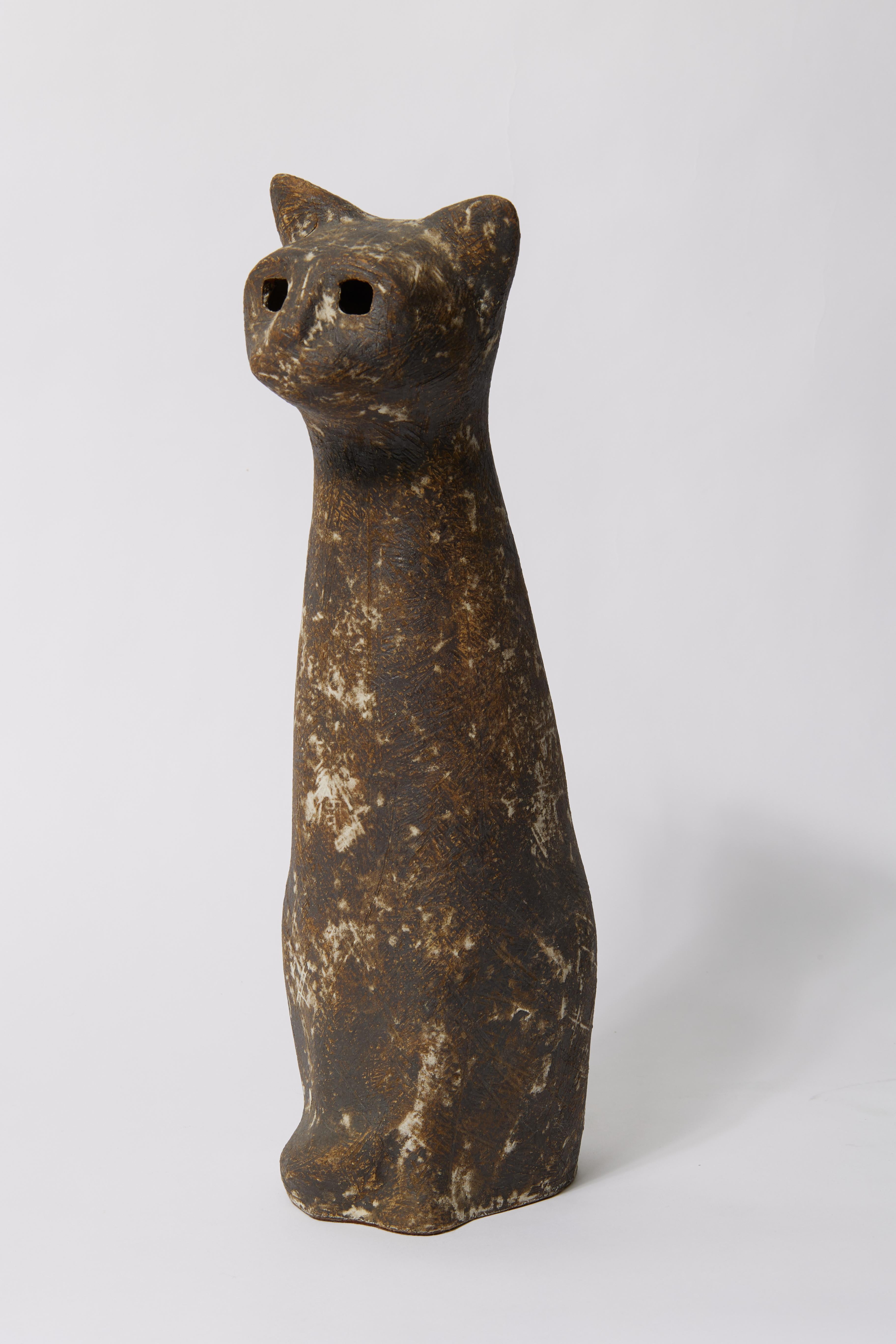 Claude Conover (American, 1907-1994)
Cat, c. 1970
Glazed stoneware
Signed to underside
14.5 x 4.5 x 6.75 inches

Claude Conover worked for 30 years as a commercial designer before turning to ceramics.  By the 1960s he was devoting himself full time