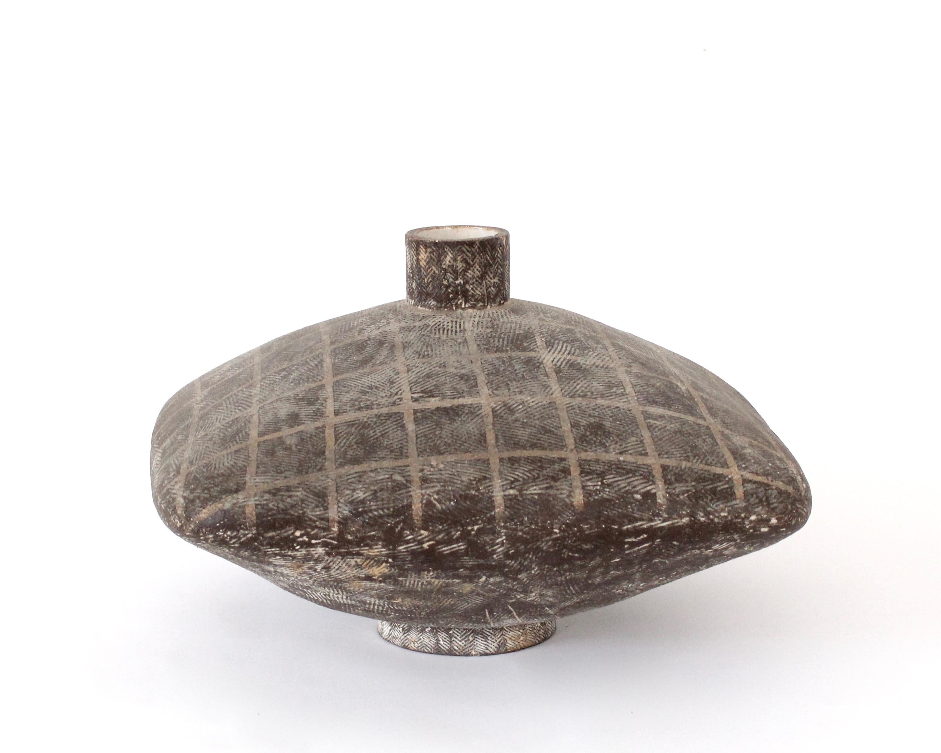 Claude Conover large pillow form ceramic vessel. 
This stoneware vase is glazed in two different tones and finely decorated with Conover's signature one iconic markings. Classic and contemporary in form, this bold and unique ceramic vessel has