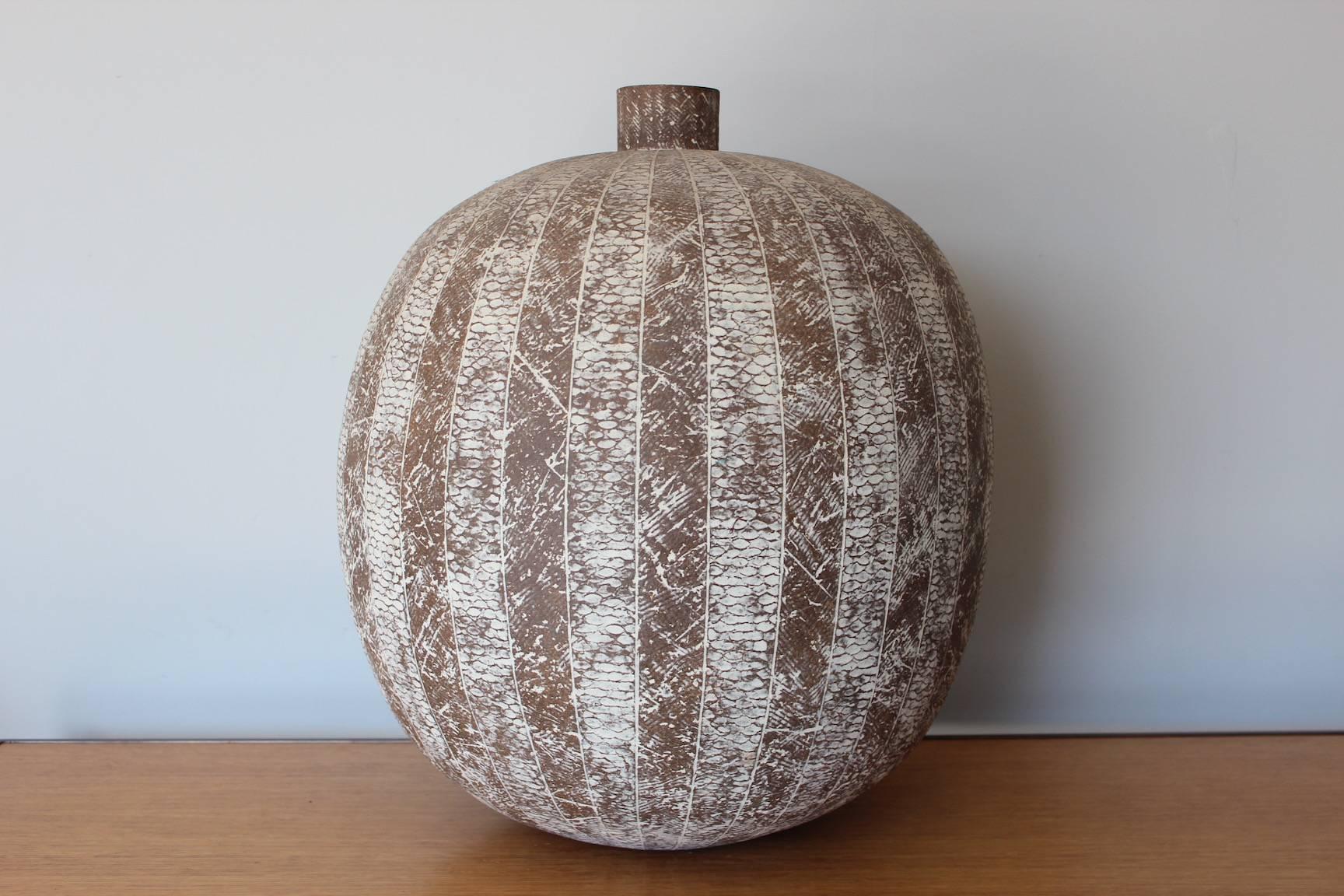 A large ceramic vase by Claude Conover titled 