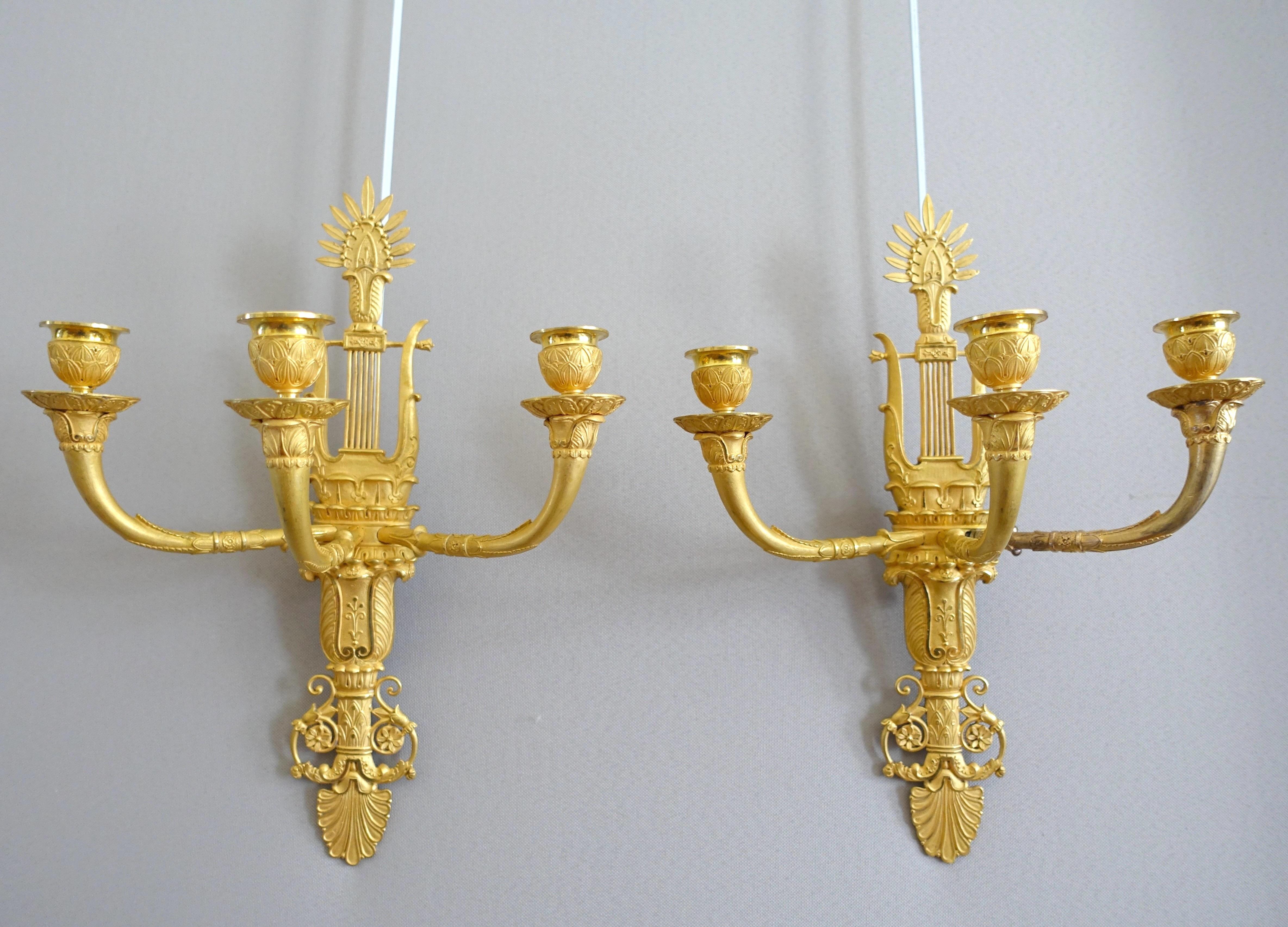 A fine pair of ormolu sconces, 3 lights each, Empire period, early 19th century period circa 1810. Attributed to Claude Galle.
Mercury gilt has been outstandingly preserved after over 200 years. Its matte and shiny finish enhances contrasts.
A sober
