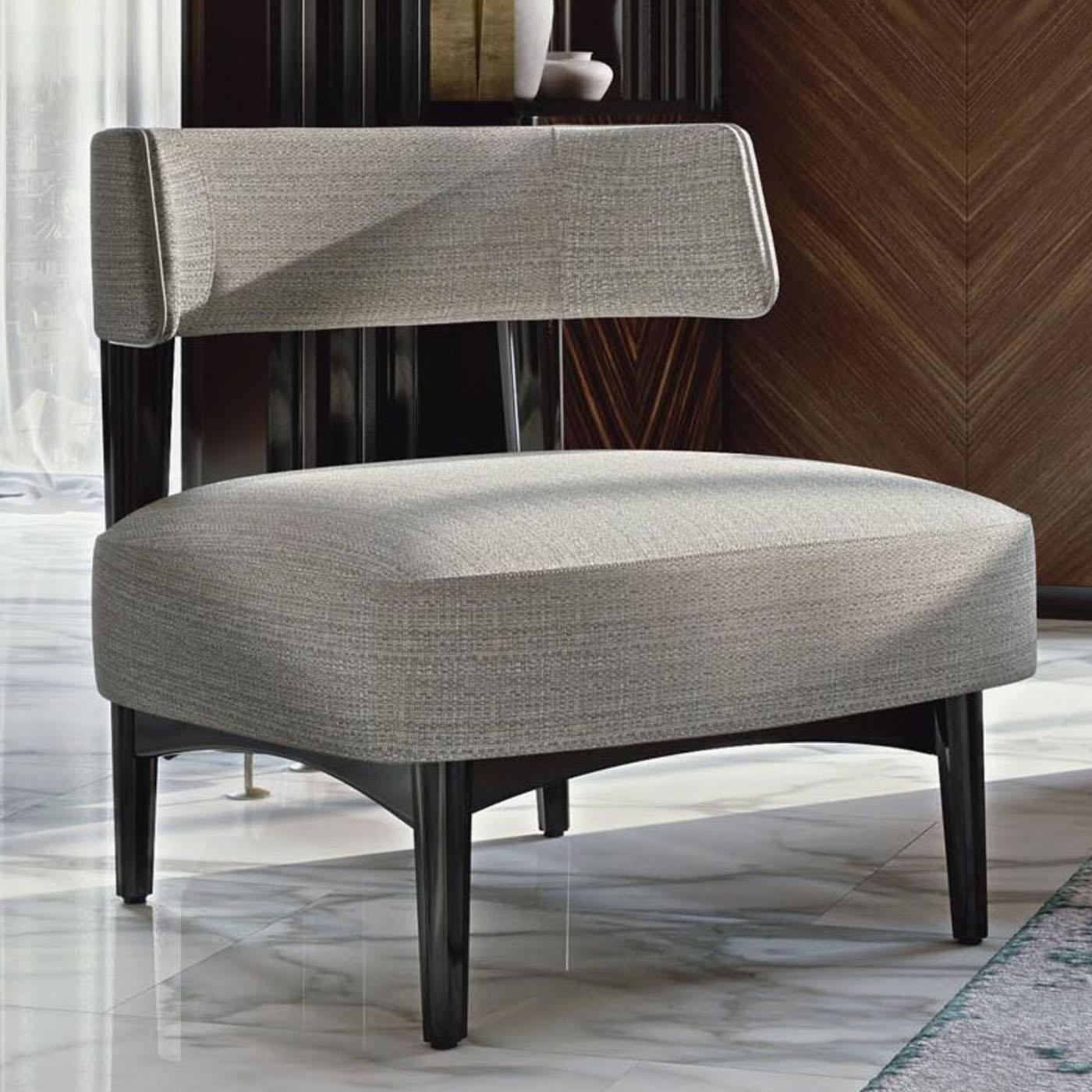 The perfect spot to relax in the company of a good glass of wine by the fireplace in a modern home, this lounge chair masterfully couples elegance and simplicity. The linear beech structure comes offered in a deep gray shade that well harmonizes