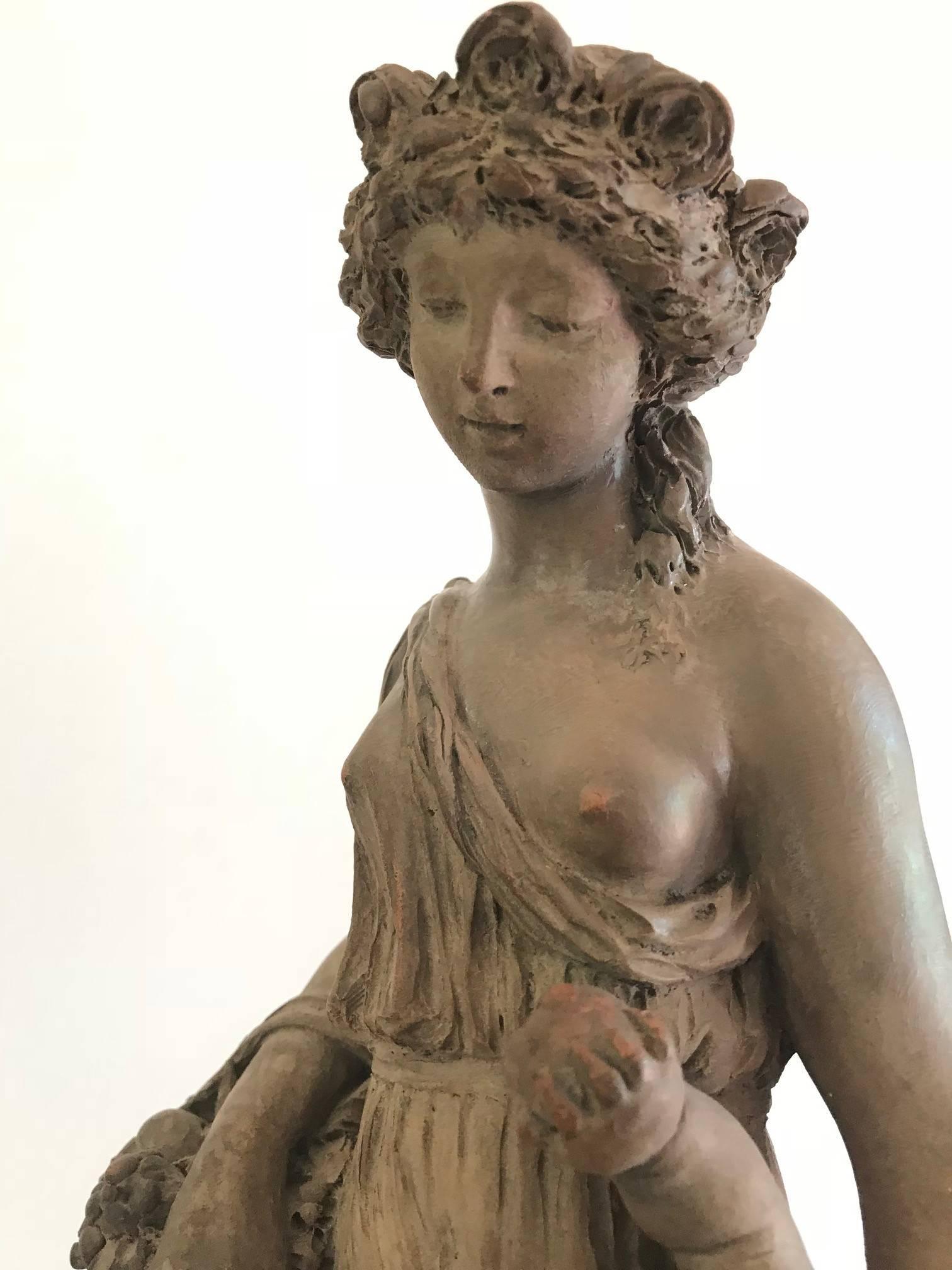 Charming and expressive terracotta sculpture  of a young maiden and child,  after Claude Michel Clodion ( 1738-1814) .
Clodion was one of the most esteemed sculptors of the 18th century. He worked frequently with terracotta, or baked clay,  highly