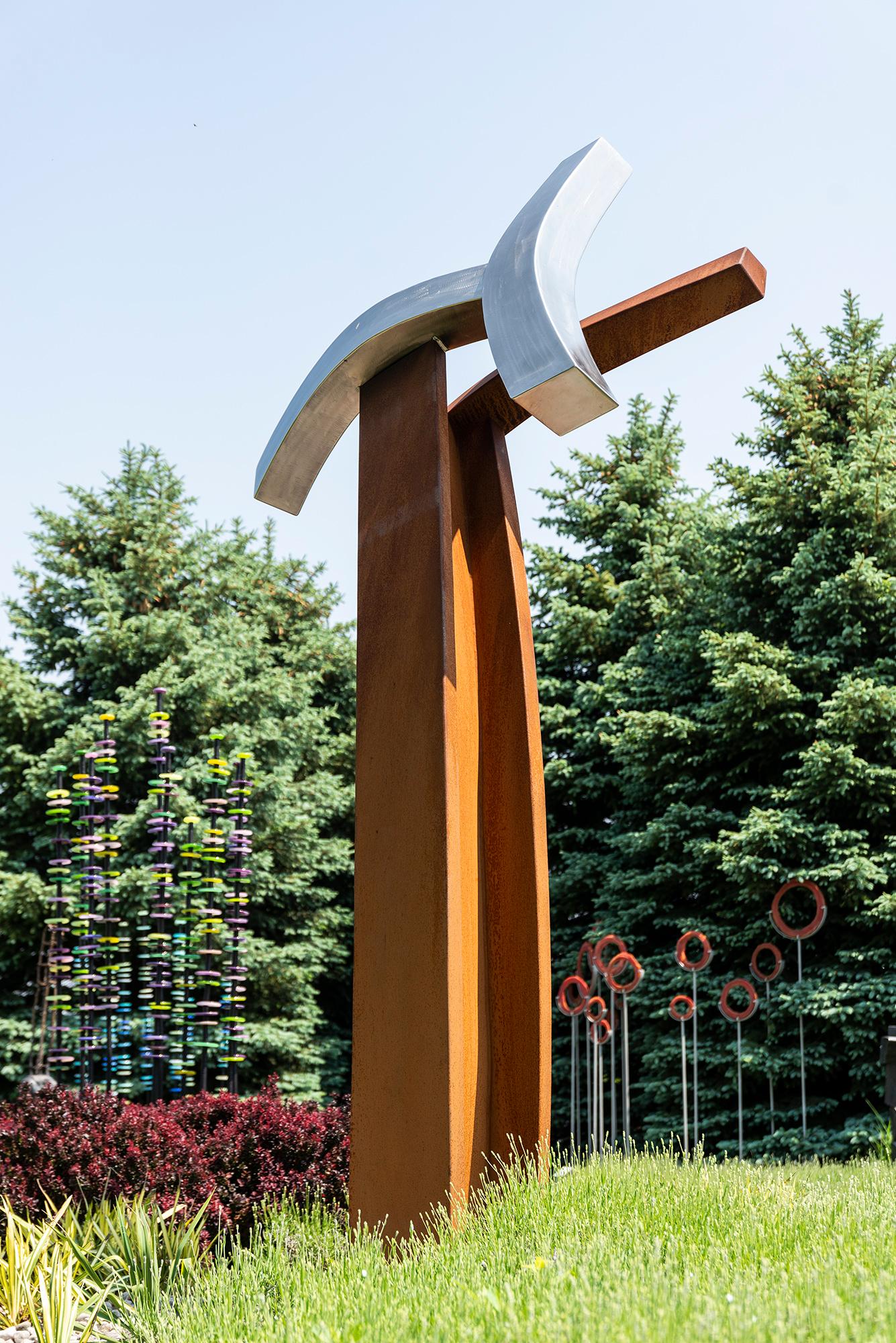 This contemporary abstract outdoor sculpture is forged from steel.

The dynamic, eclectic sculptural work of Quebec artist Claude Millette is highly regarded for its innovation in both its design and its production.
Millette is avant-garde—a