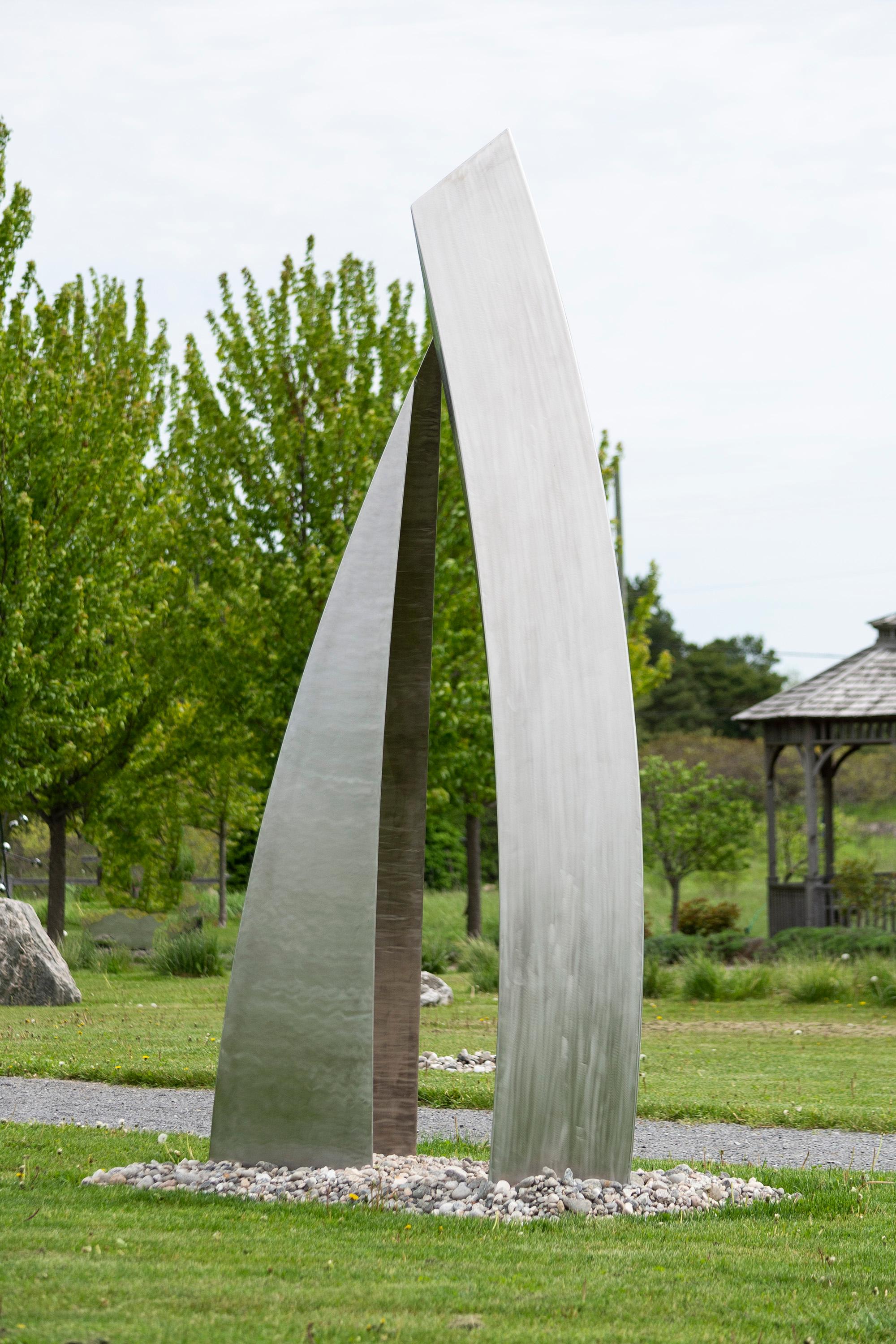 Sculptor Claude Millette's distinctive contemporary sculptures grace many public spaces in Canada. This large abstract outdoor piece, Recontre (French for ‘encounter’) is forged from stainless steel and features two powerful forms—a graceful arch