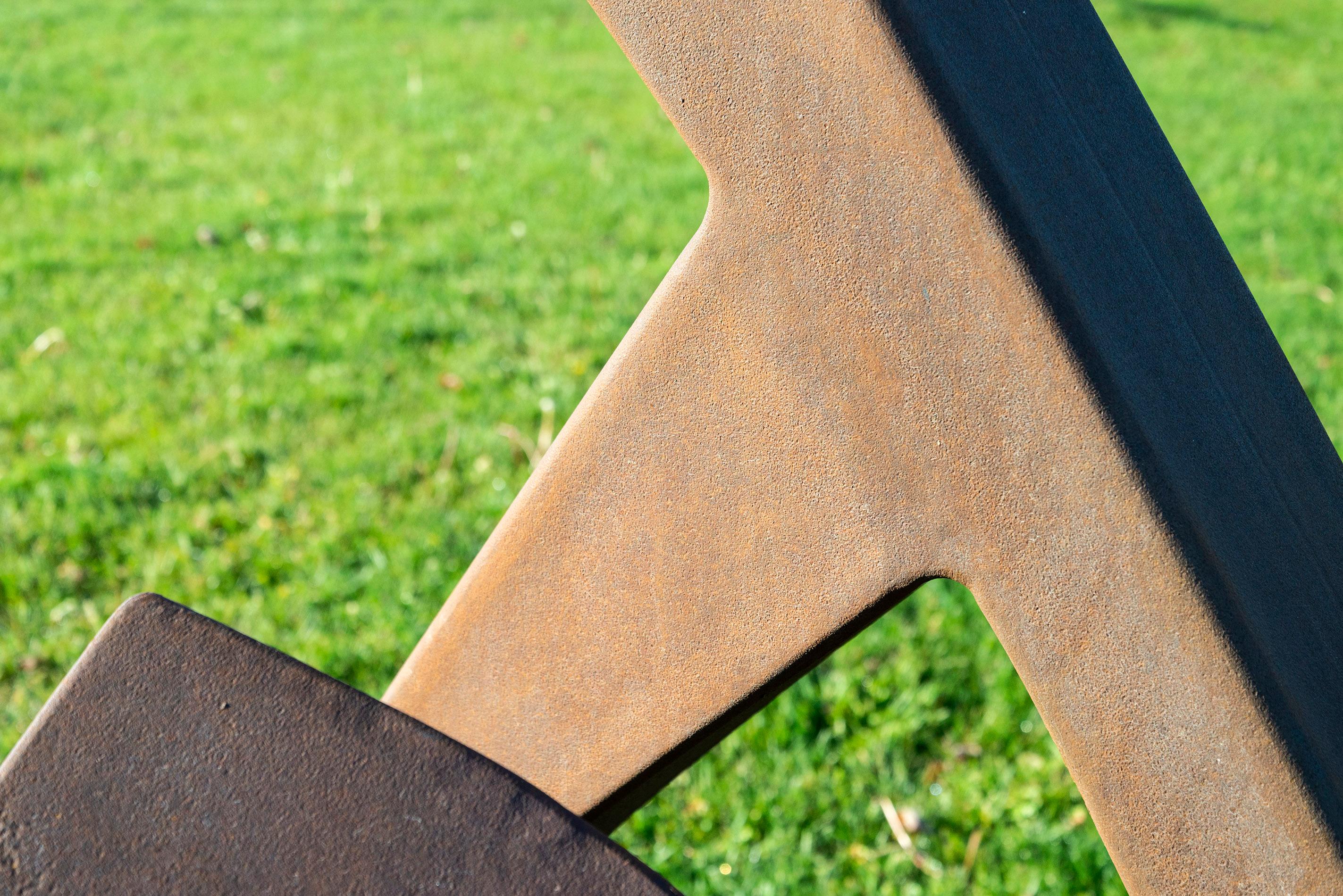 This imposing outdoor sculpture was created by Quebec artist Claude Millette. Six quadrangular beams of corten steel twist and fold resting on the ground. ‘Trajectoire’ means ‘trajectory’ in French and this sculpture does possess a sense of upward