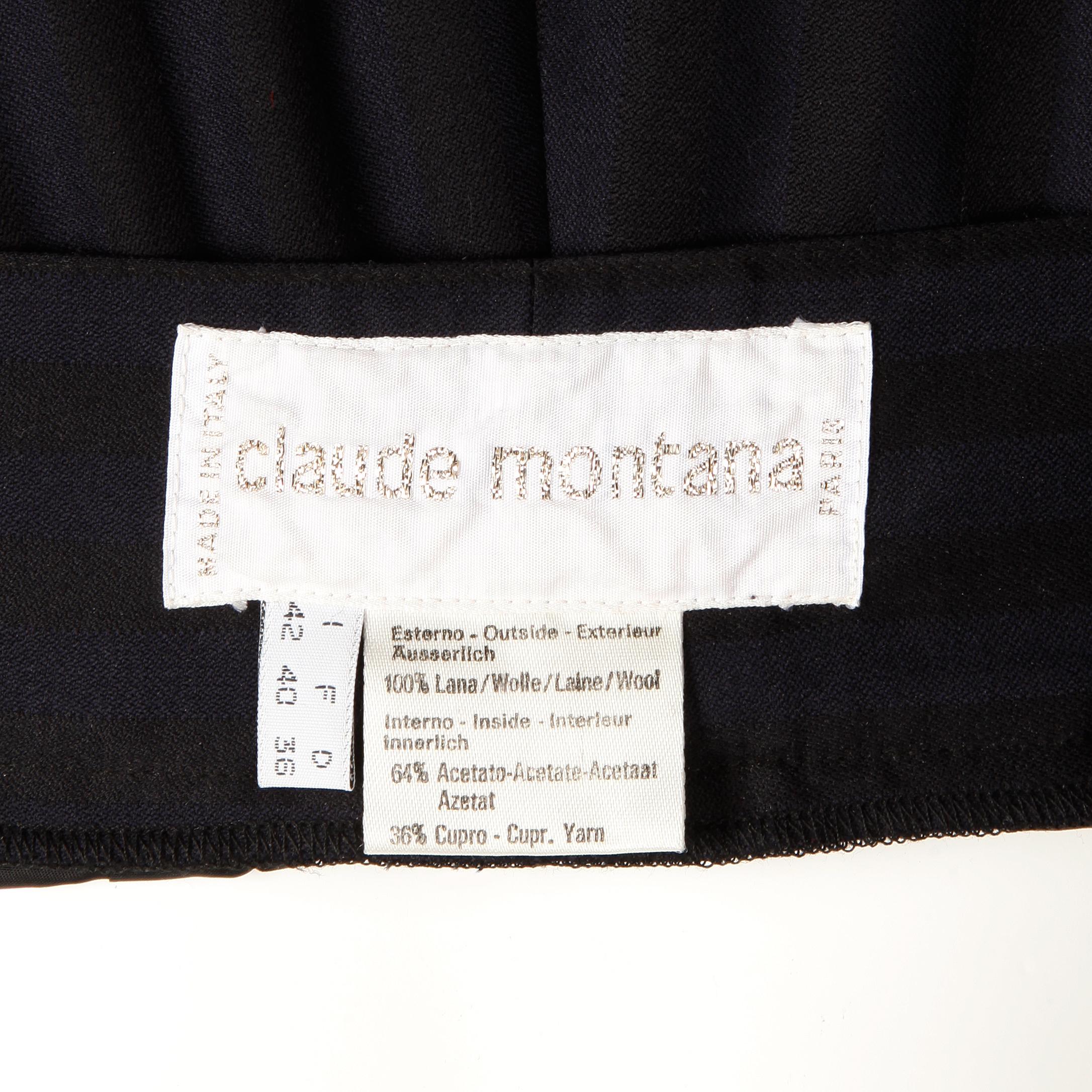 Vintage 1980s black and navy blue striped wool pants or trousers by Claude Montana. Fully lined with front button and zipper closure. 100% wool with 64% acetate, 36% cupro. The marked size is I-42, F-40, D-36, GB-34, BS-38, USA-8. Hidden side