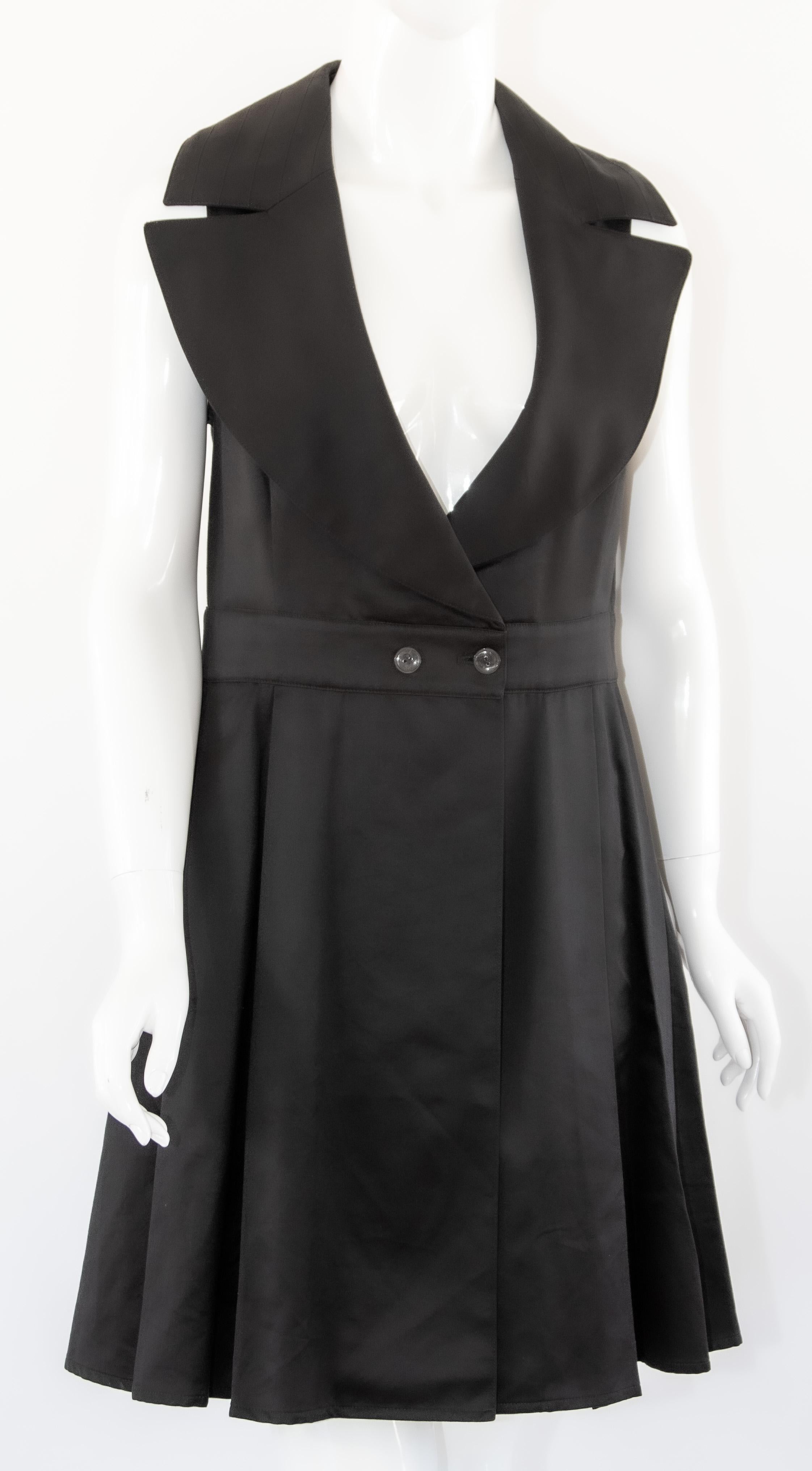 Claude Montana black cocktail mini dress.
State of Claude Montana sz 10 little black dress Black sleeveless little cocktail dress.
Button back mid calf length dress with oversized collar and side pockets. 
Excellent condition. 
Fabric: 100 %