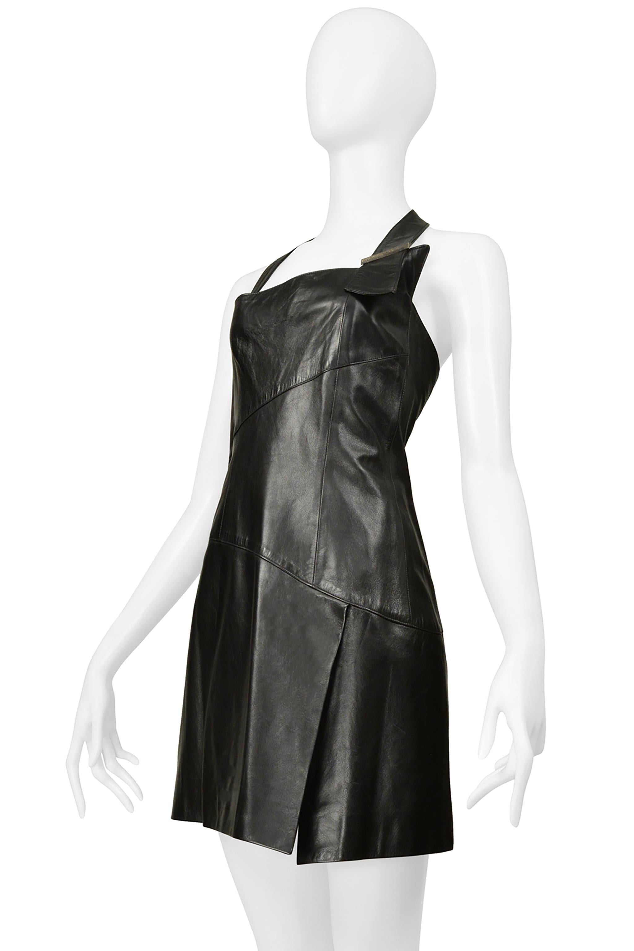 Resurrection Vintage is excited to offer a vintage Claude Montana black leather mini-dress featuring leather panels, a halter strap with decorative bronze-tone hardware, side zipper closure, and mini length. 
* Claude Montana 
* Size 36
* Lambskin