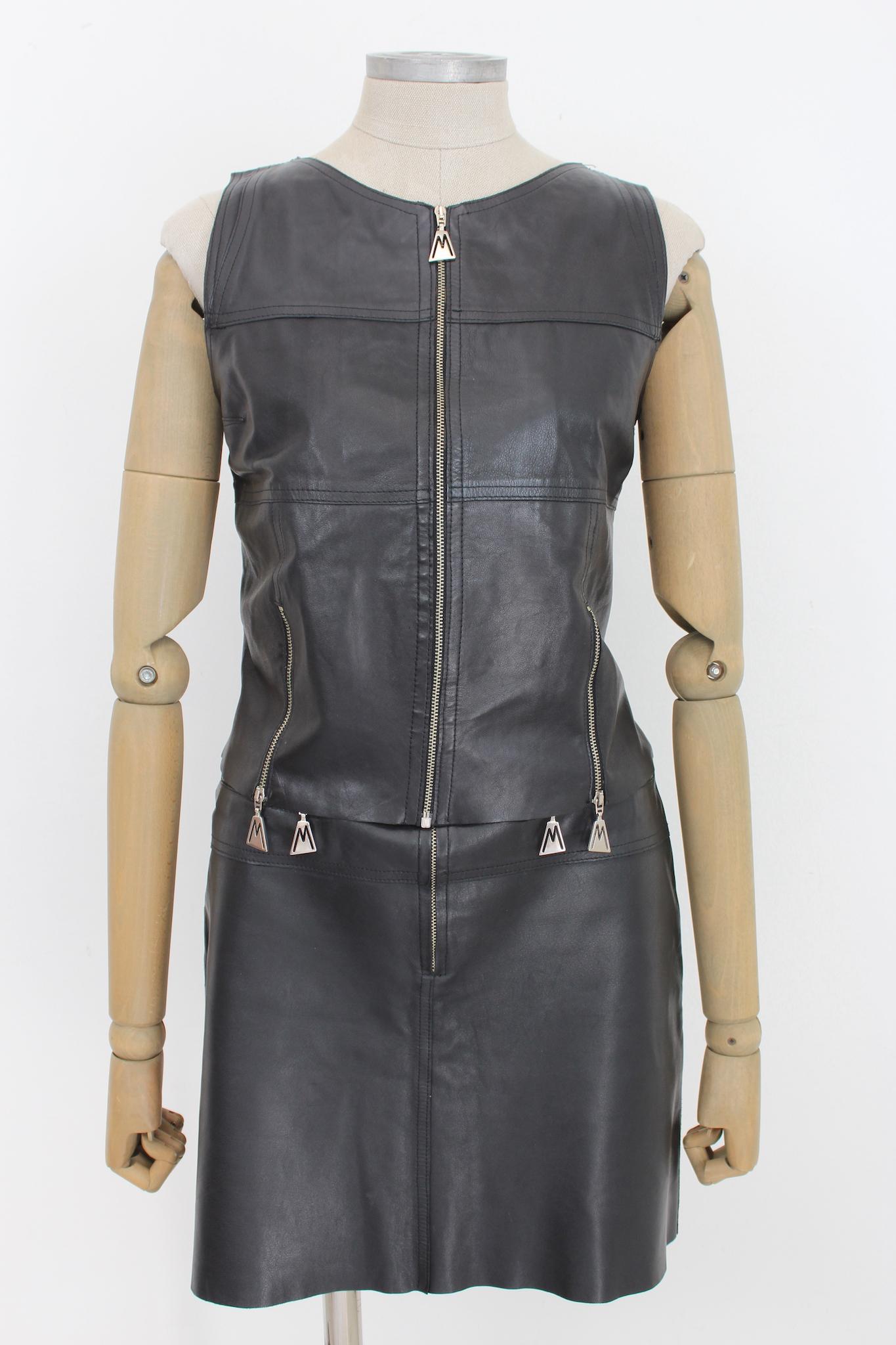 80s vintage black leather suit by designer Claude Montana. Biker-style vest and skirt in soft leather with logoed zips. Flared skirt with raw cut, fitted vest, internally lined. Made in Italy.

Size: 42 It 8 Us 10 Uk

Shoulder: 34 cm
Bust / Chest: