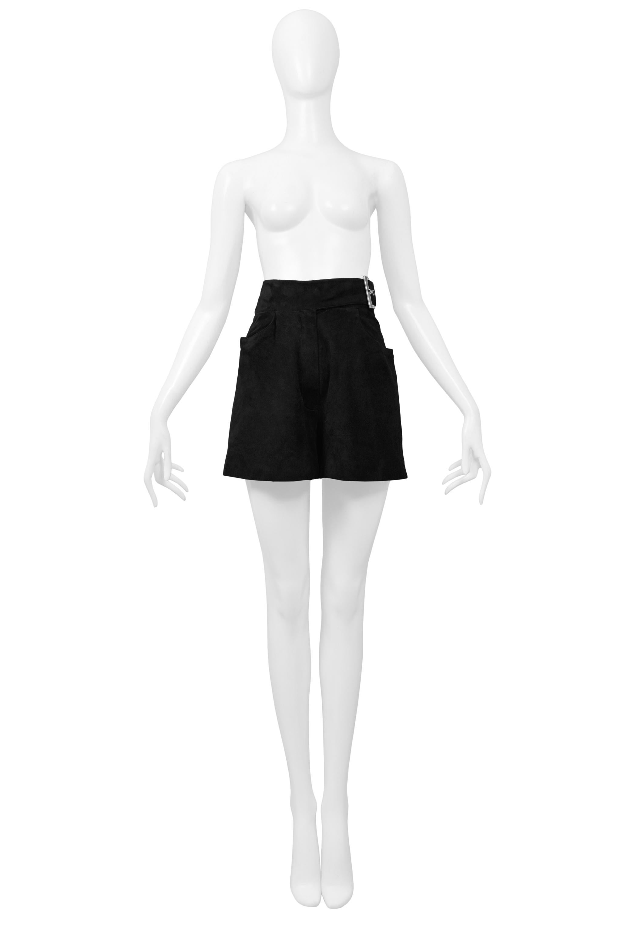 Resurrection Vintage is excited to offer a pair of vintage Claude Montana black suede high-waisted shorts featuring a belted waist with a large silver-tone buckle, pockets at the front & back, and a lined interior. 

Claude Montana 
Size