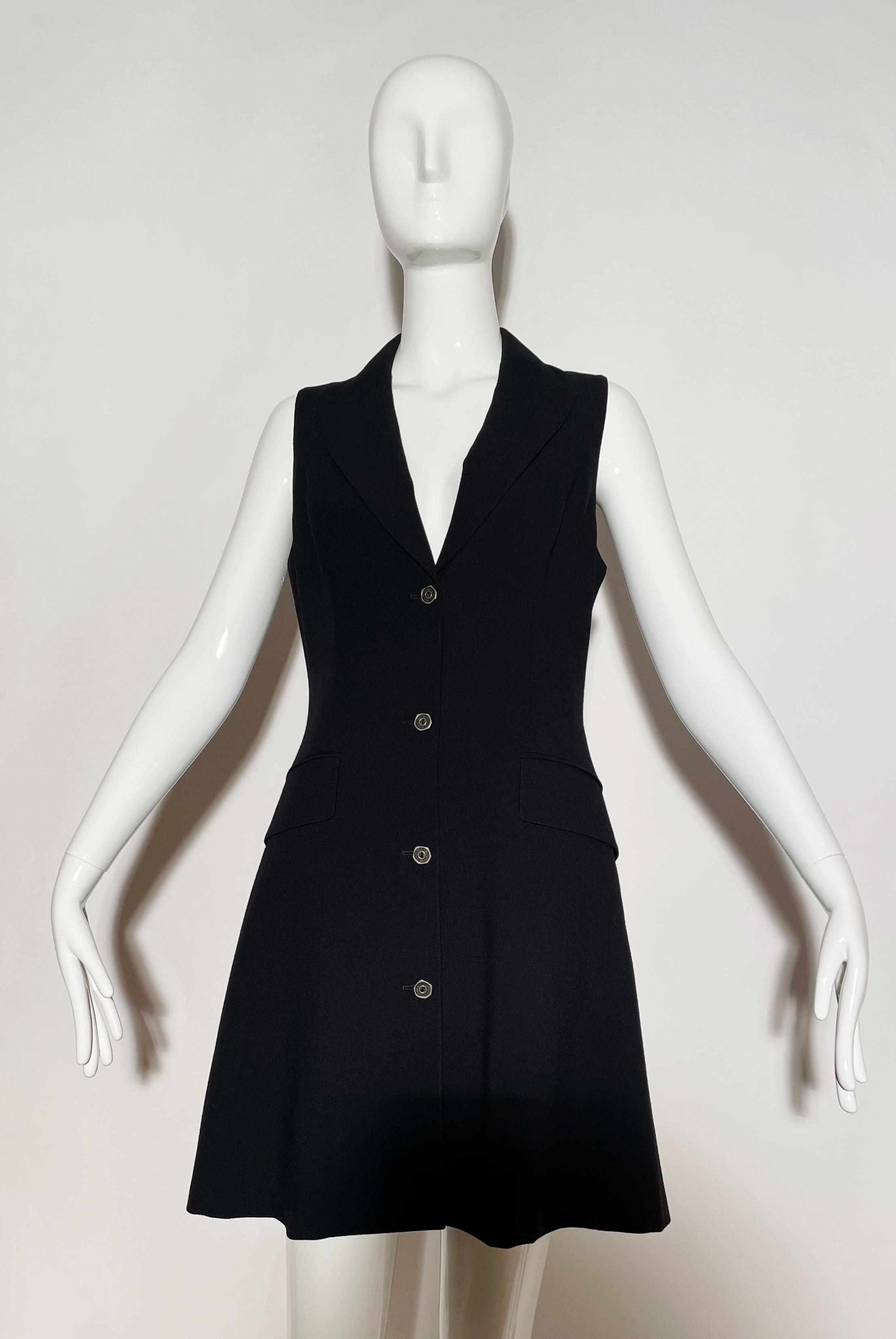 Black sleeveless blazer dress. Vest style. Lapel. Front pockets. Button closures. Lined. Wool. Made in Italy. 
*Condition: excellent vintage condition. No visible flaws.

Measurements Taken Laying Flat (inches)—
Shoulder to Shoulder: 13 in.
Bust: 32