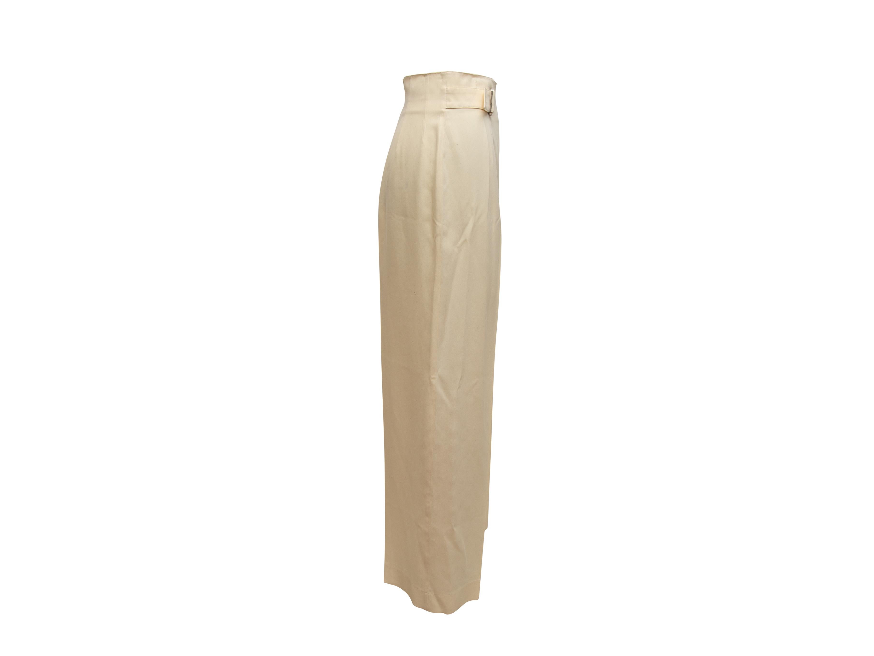Product details: Vintage cream high-rise pants by Claude Montana. Silver-tone buckle closures at hips. Designer size 42. 28