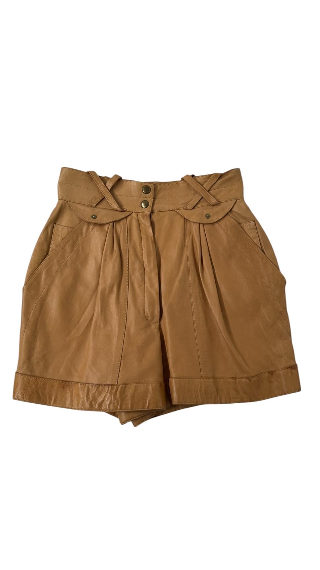 These ultra-structured leather shorts by Claude Montana for Idéal Cuir are an exceptional example of the designer's avant-garde mastery in the early 1980s. Crafted in supple camel-colored lambskin, the piece reflects Montana's signature approach to