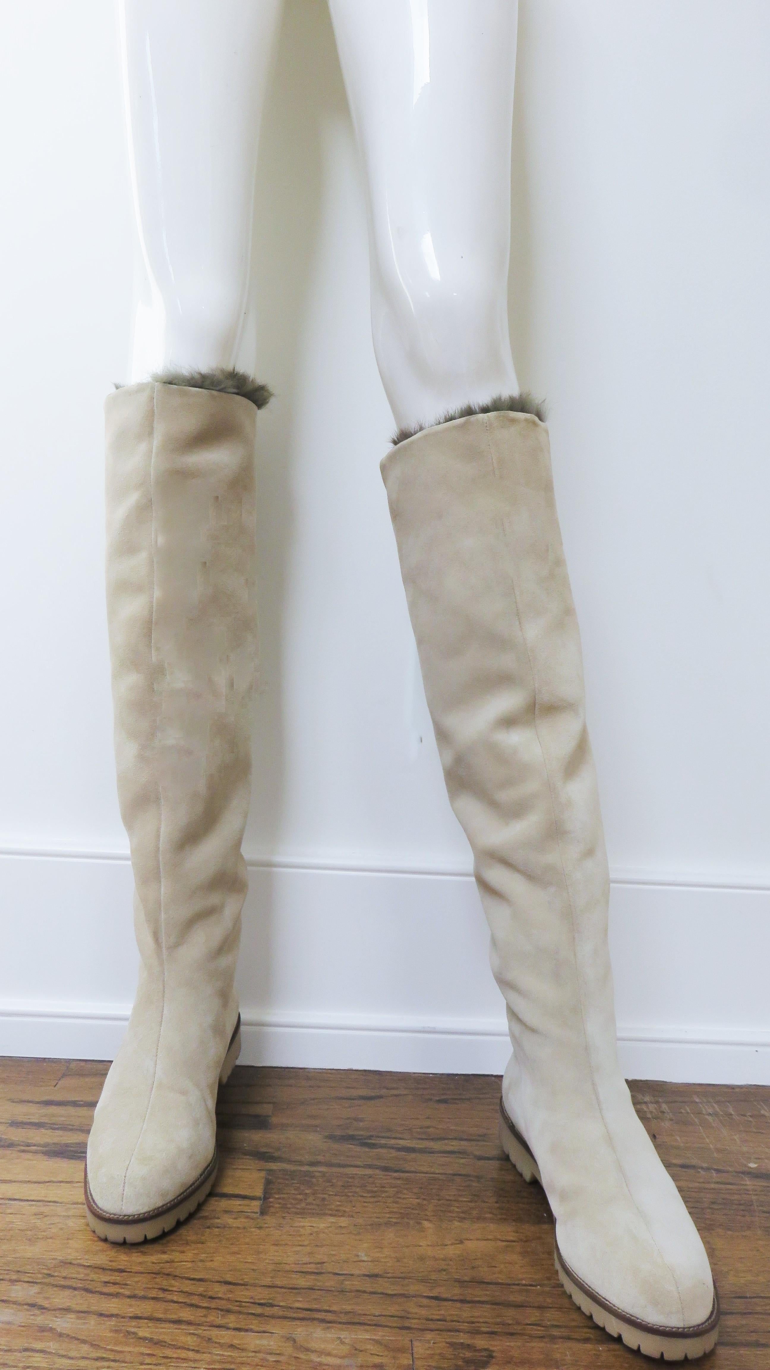Gorgeous beige suede fur lined boots by French designer Claude Montana.  Knee height or over the knee (my mannequin is on tip toes) they are lined in soft brown fur and can be folded down at the top. They have 1
