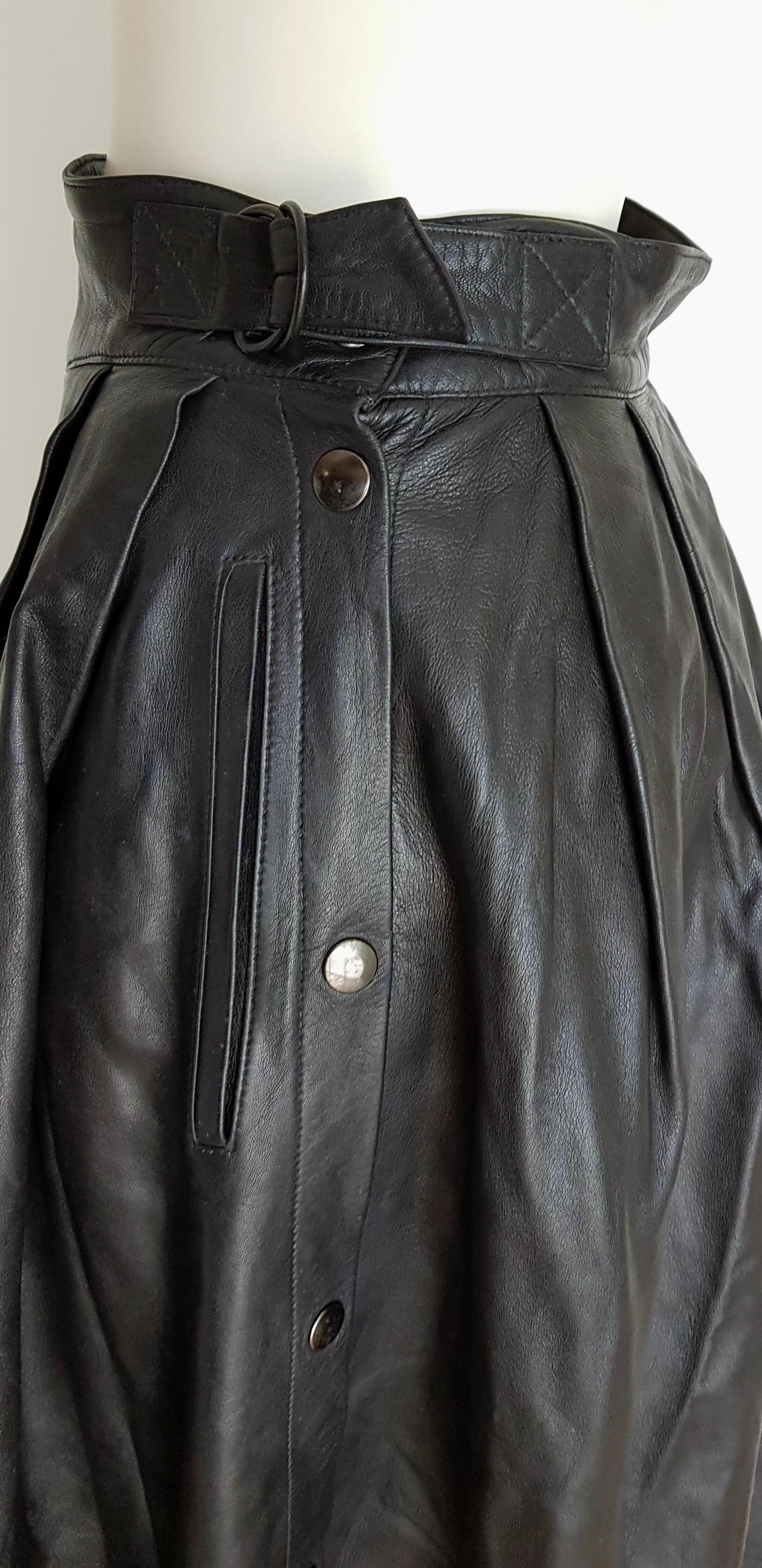 Claude MONTANA black lambskin leather buttons and buckle skirt - Unworn, New.

SIZE: equivalent to about Small / Medium, please review approx measurements as follows in cm: lenght 85, waist circumference 72. 
TO CONVERT: cm x 0.39 =