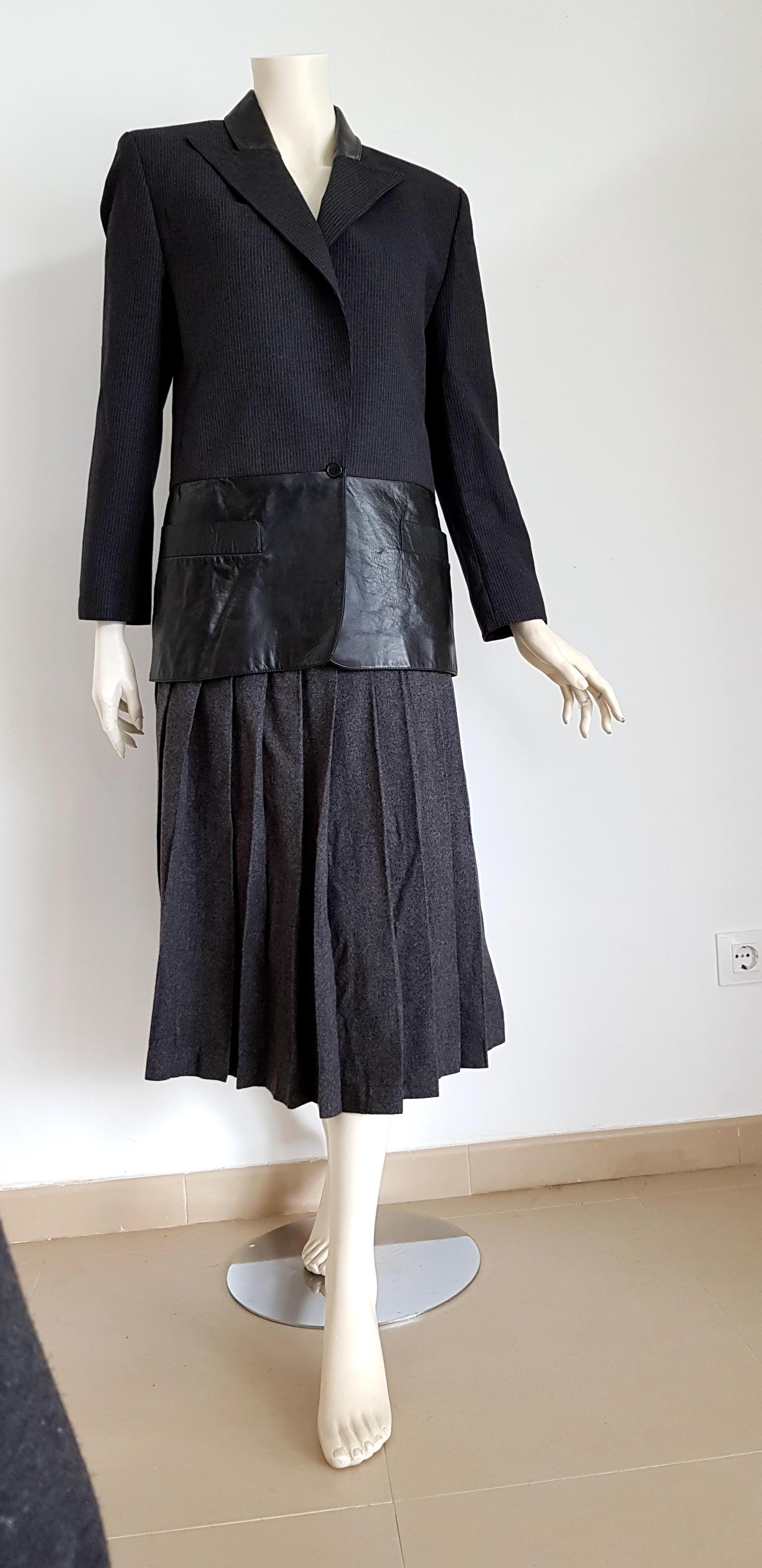 Claude MONTANA  wool and leather dark grey, jacket with light lines, skirt suit - Unworn, New.
..
SIZE: equivalent to about Small / Medium, please review approx measurements as follows in cm. 
JACKET: lenght 75, chest underarm to underarm 55, bust