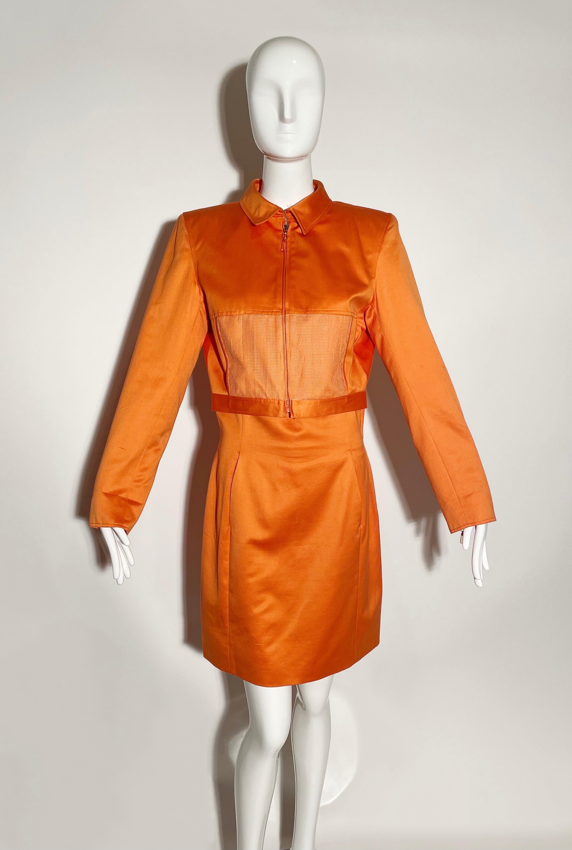 Orange skirt suit. Cropped, collared blazer with mesh front pockets. Shoulder pads. Zipper closure at front and wrists. High waisted skirt with front pockets. Lined. Cotton. Made in Italy. 

*Condition: Excellent vintage condition. No visible flaws.