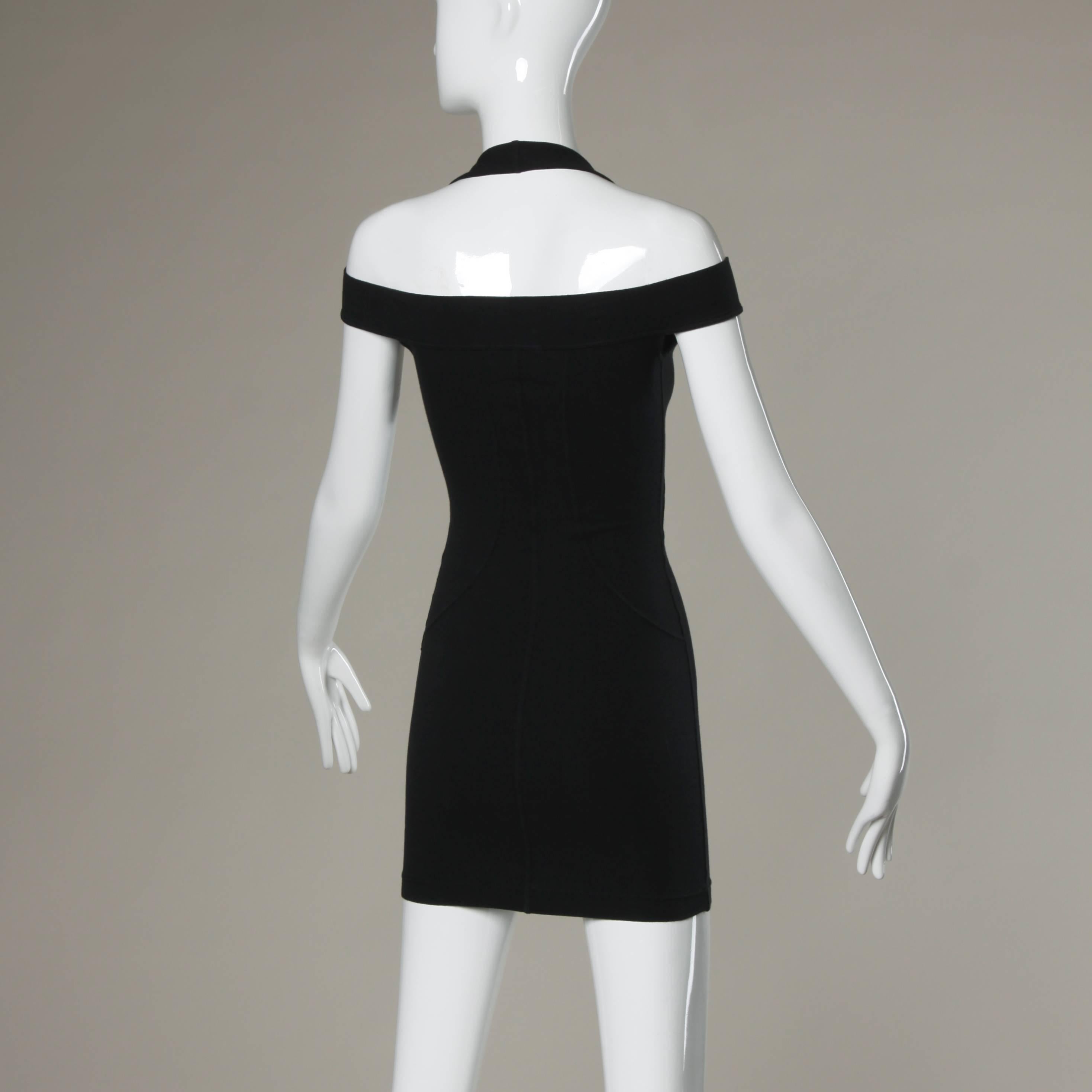 Sexy black stretchy body con dress by Claude Montana. Unique body hugging fit with cut out shoulders and halter neckline. No marked size, but fits like an XS-S.