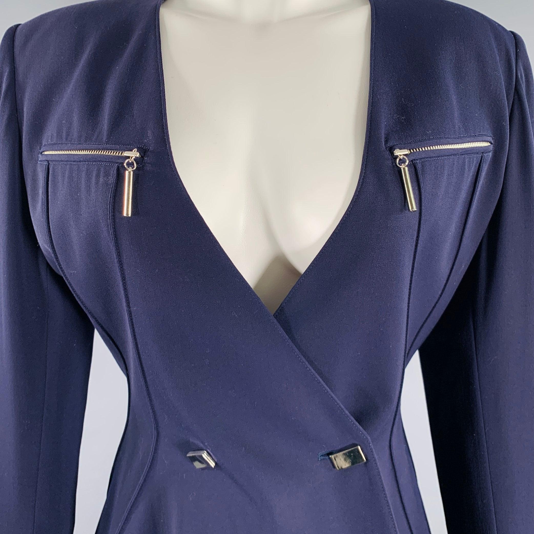 Vintage CLAUDE MONTANA jacket
in a purple wool featuring padded shoulders, silver tone zipper pockets, and silver tone button closure.Excellent Pre-Owned Condition. 

Marked:   JP 9 

Measurements: 
 
Shoulder: 18 inches Bust: 34 inches Sleeve: 19.5