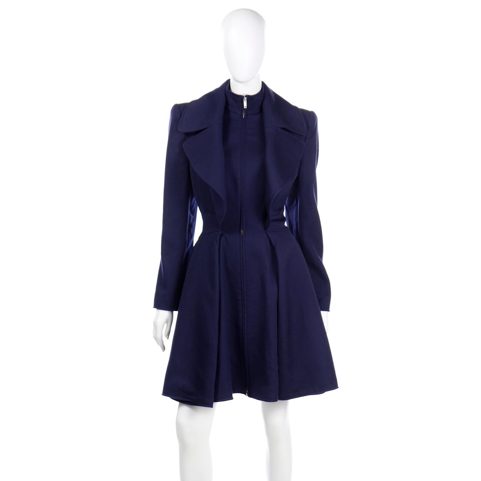 This vintage Claude Montana princess style coat is absolutely breathtaking! The coat is in a luxe royal blue fine wool and is fully lined. We love the way the zipper is partially concealed by the extra wide lapels, giving the illusion of layered