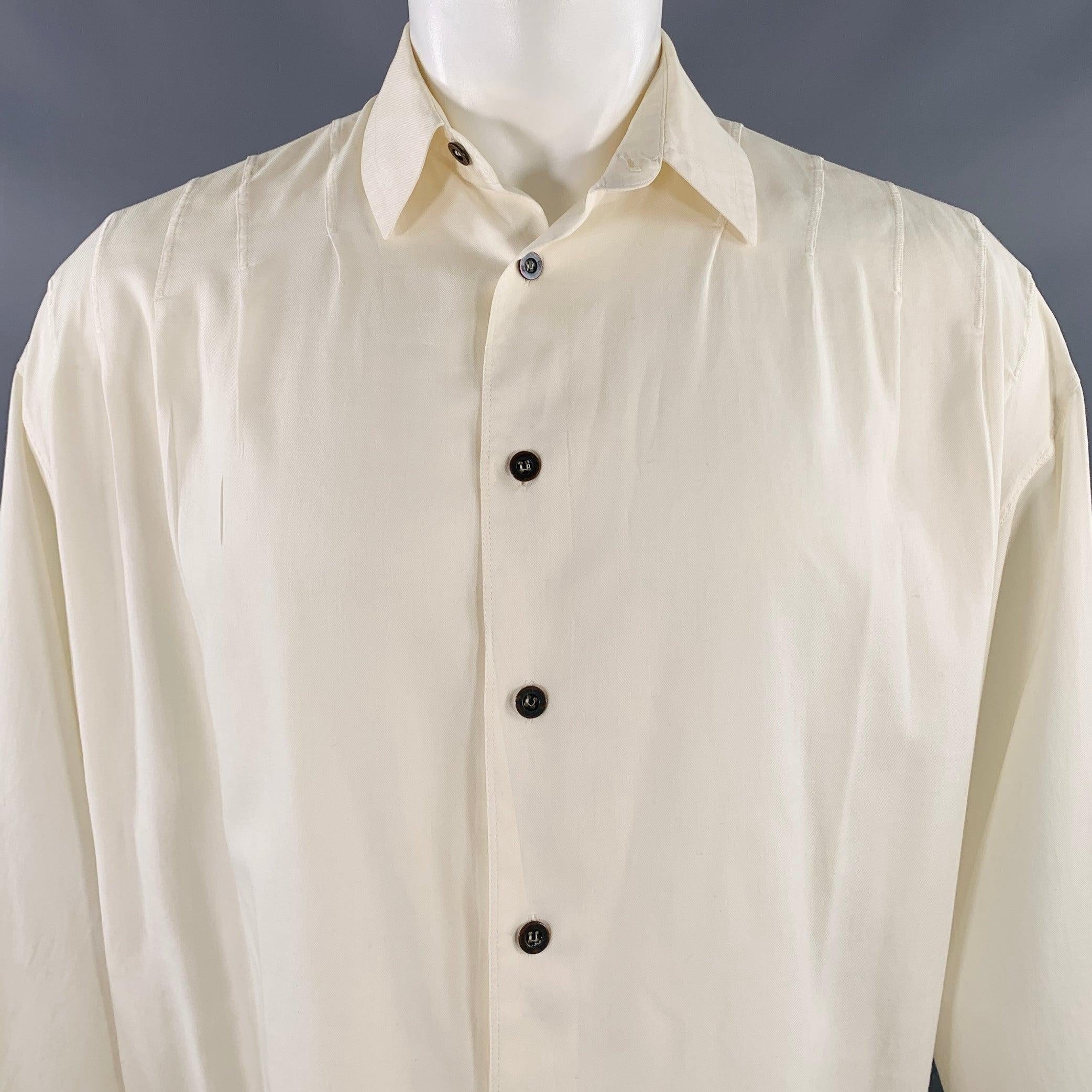 Vintage CLAUDE MONTANA long sleeve shirt
in a white cotton woven fabric featuring shoulder pleats, spread collar, oversized fit, and button closure.Good Pre-Owned Condition. Moderate marks and signs of wear. Please check photos, as is. 

Marked:  