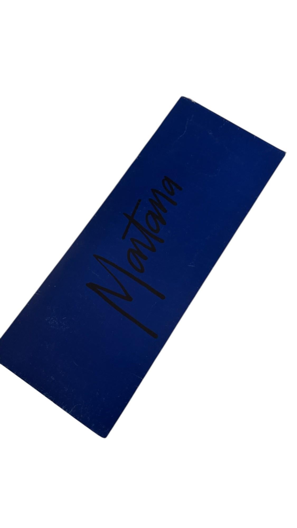 Italy
This striking vintage tie by Claude Montana features an eye-catching graphic design composed of bold rectangular blocks in gradient shades of teal, turquoise, and emerald green set against a deep navy blue background, overlaid with the