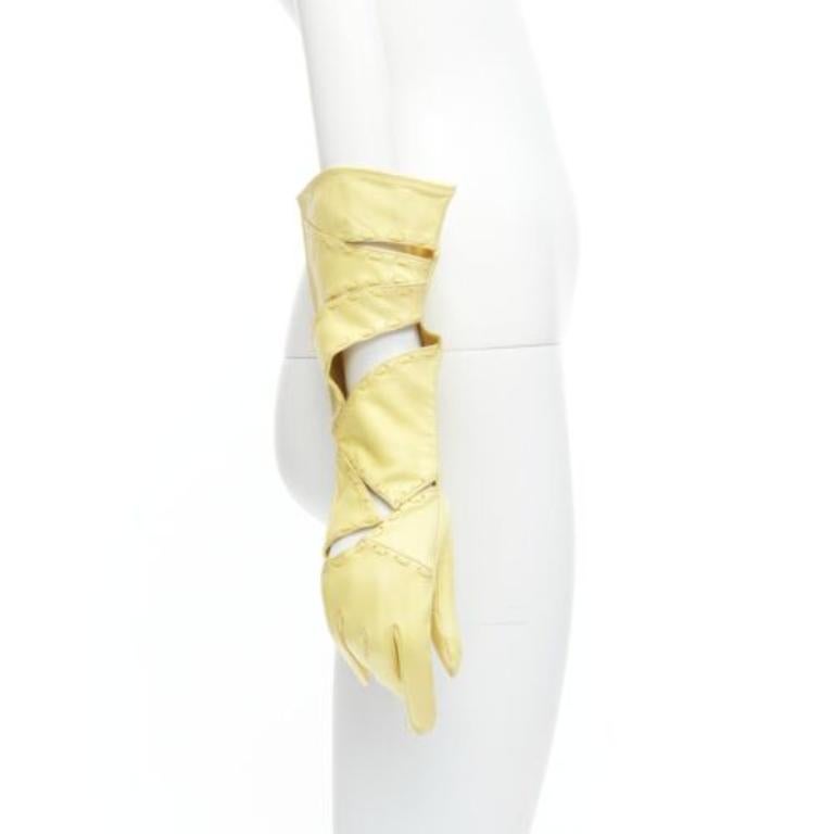 CLAUDE MONTANA Vintage yellow leather topstitch cut out gloves US7
Reference: GIYG/A00379
Brand: Claude Montana
Material: Leather
Color: Yellow
Pattern: Solid
Lining: Yellow Leather
Made in: France

CONDITION:
Condition: Fair, this item was