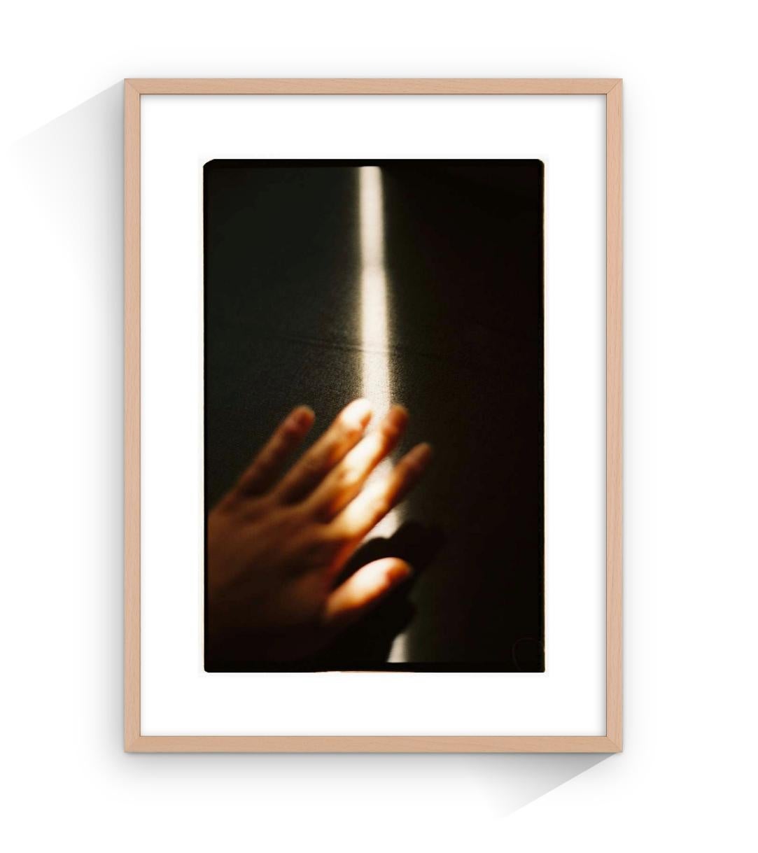 Infinite warm, hands, analog photography, natural light, cave, shelter - Photograph by Claudia Ferreiro