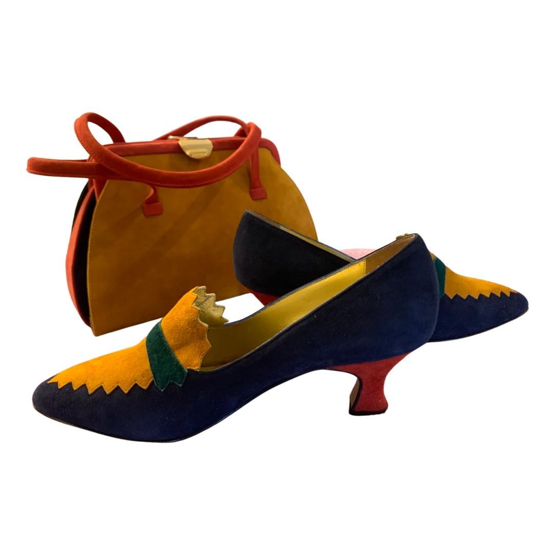 This vintage Italian set designed by Claudio Marazzi in Florence Italy has been in a fashionista closet for decades and never used. They are amazing because both the bag and shoes are done in four color suede. Ruby red, navy blue, forest green, and